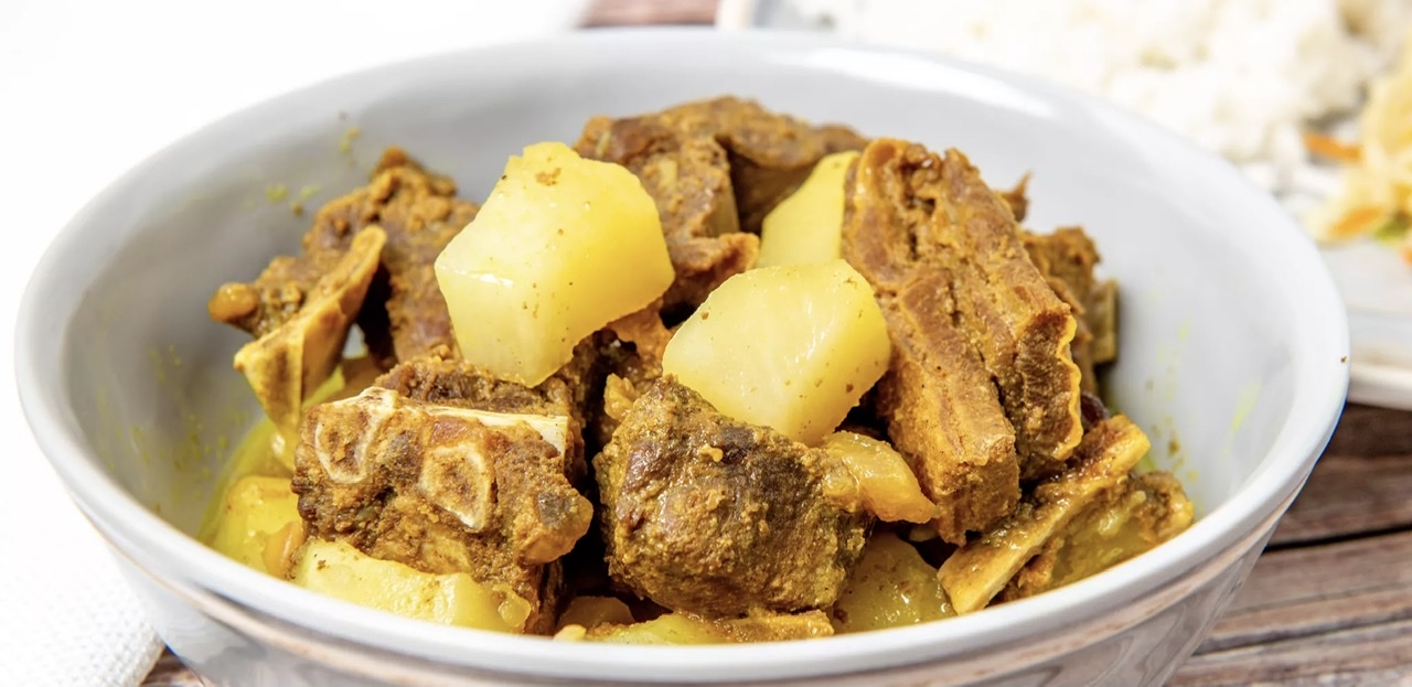 Order Curry Goat food online from Cool Runnings Eatery store, White Plains on bringmethat.com