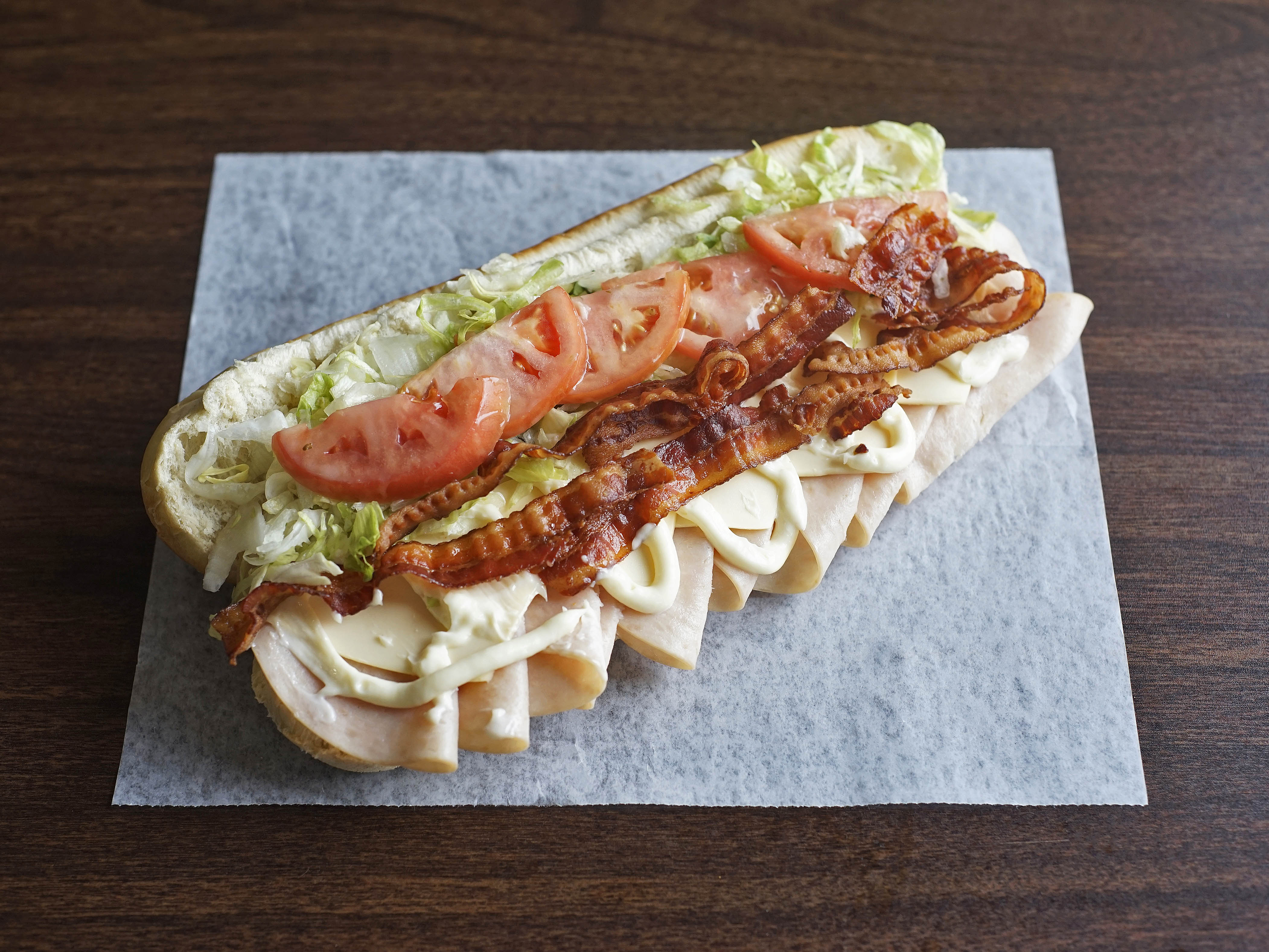 Order Turkey Club Sub food online from Tubby Grilled Submarines store, Detroit on bringmethat.com