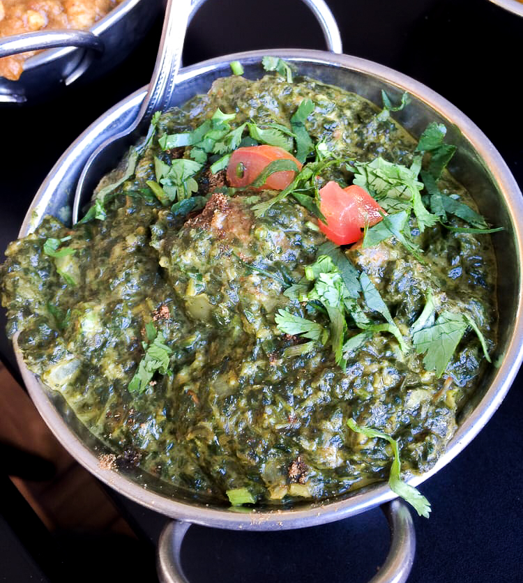 Order Saag Lamb food online from A Desi Cafe  store, San Francisco on bringmethat.com