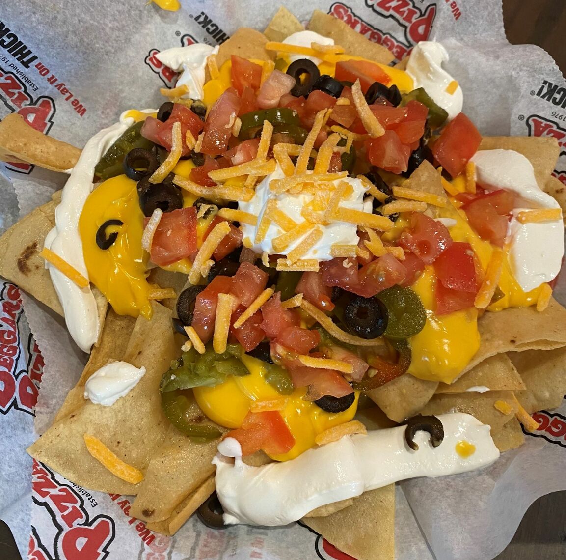Order Classic Nachos food online from Beggars Pizza store, Gary on bringmethat.com