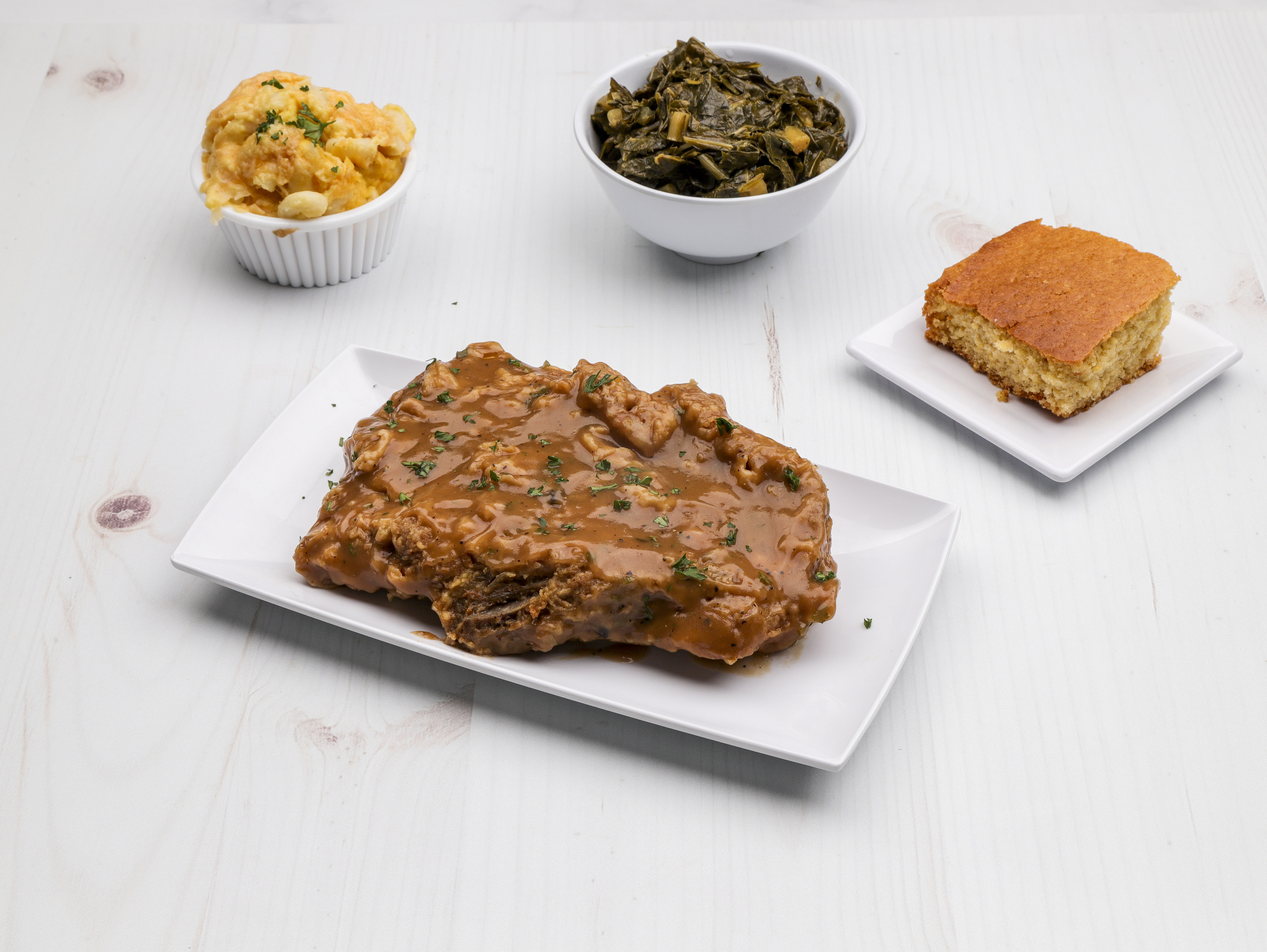 Order Smothered Pork Chop food online from Baja's Southern Cooking and More store, Gulfport on bringmethat.com