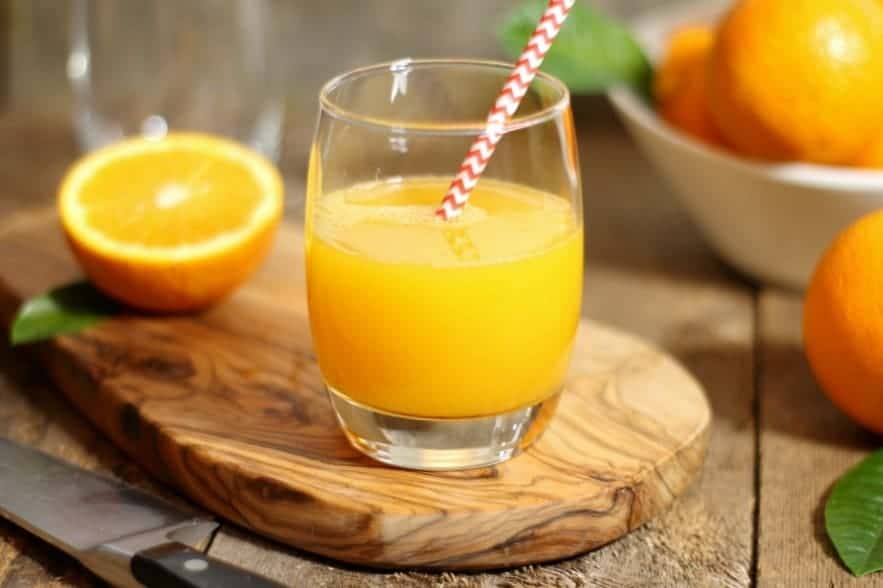 Order 100% Orange Juice 24oz food online from Taz Cafe store, New York on bringmethat.com