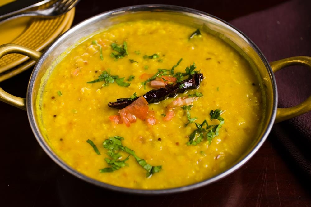 Order Daal Tadka food online from Dhaba indian cuisine store, New York on bringmethat.com