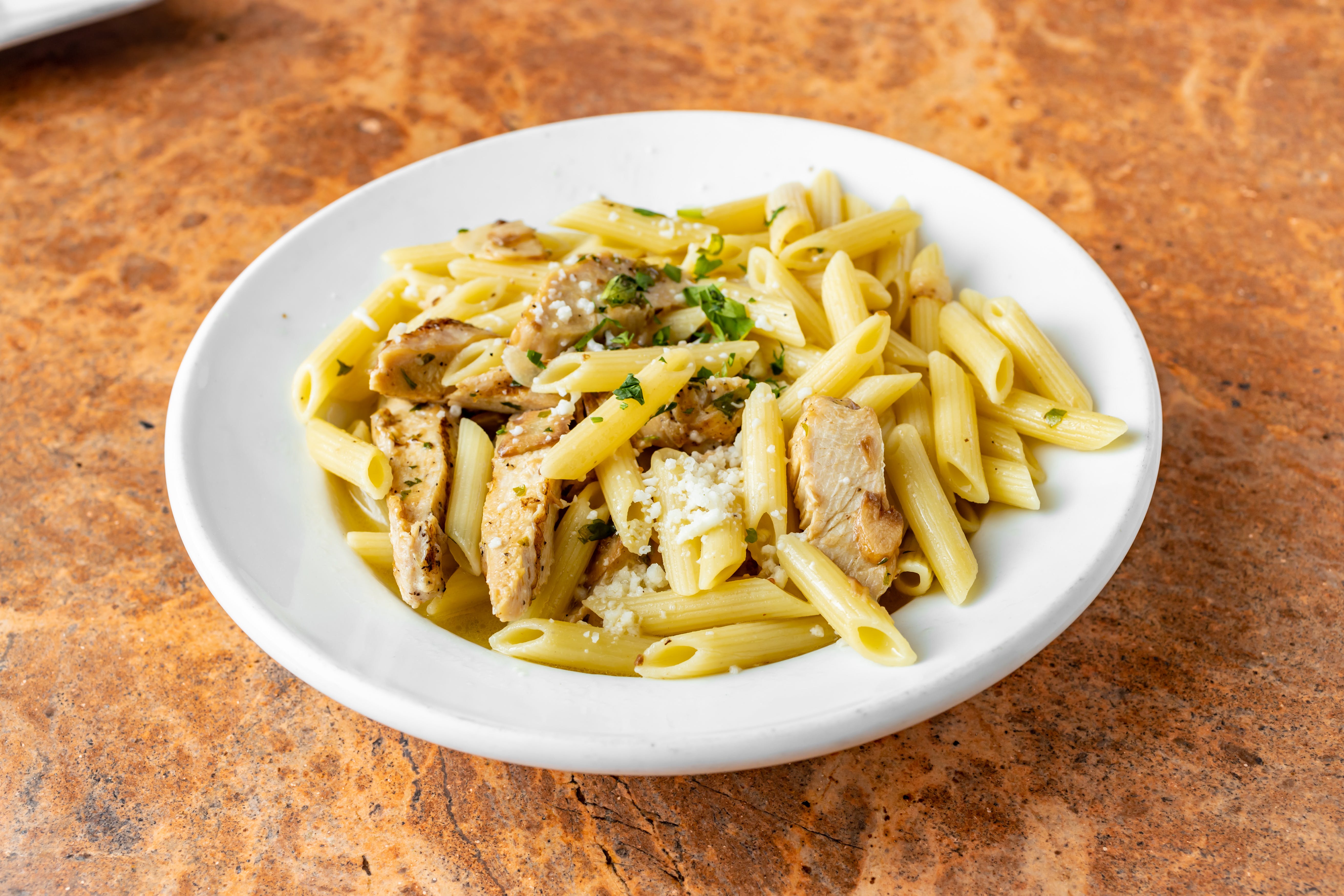 Order Penne with Grilled Chicken, Garilc & Oil Catering - Half Tray (Serves 6-8 People) food online from Bonbino's Pizza store, Oceanside on bringmethat.com