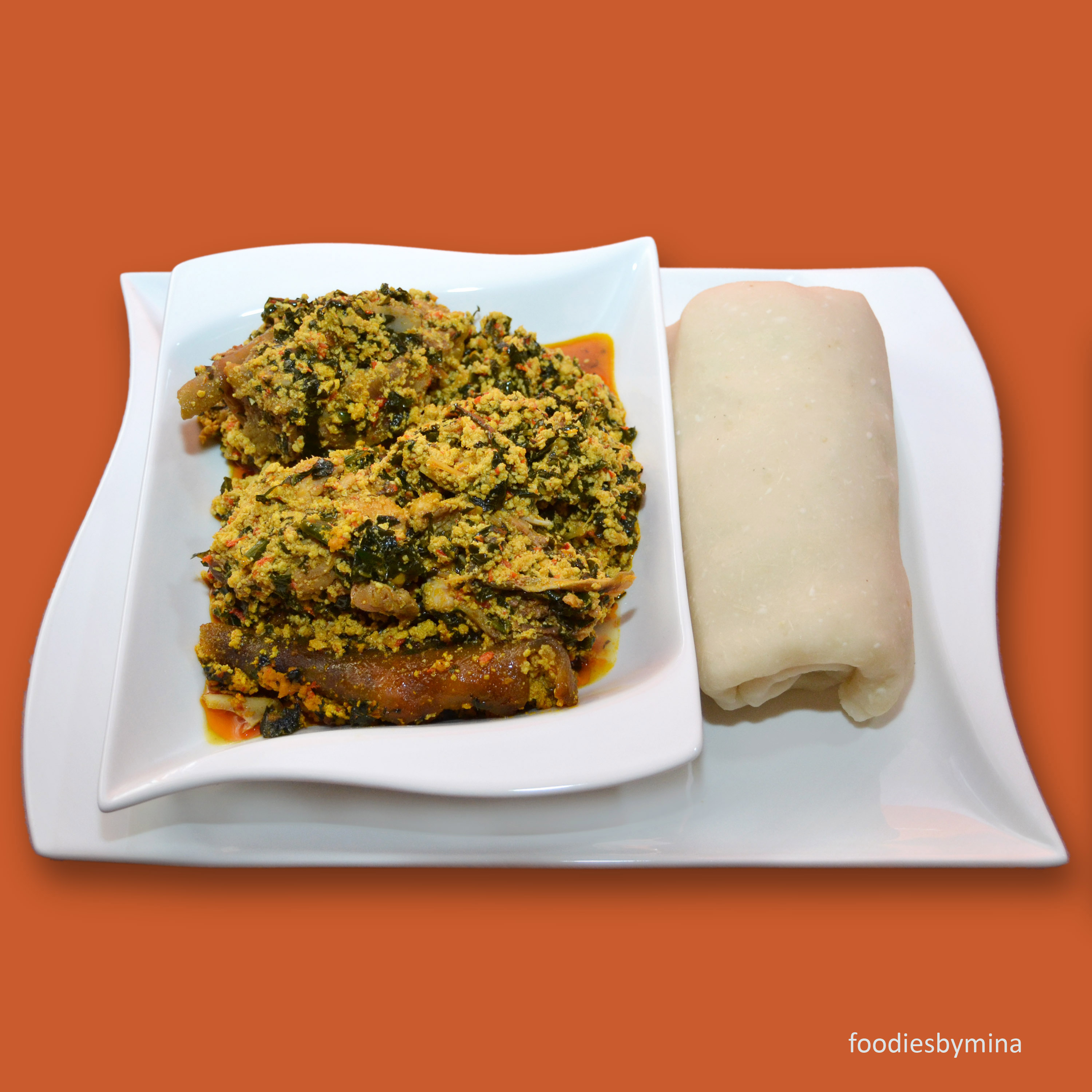 Order Egusi Soup, Collard Greens and Spinach, with Goat Meat food online from Africarib Grill store, Newark on bringmethat.com