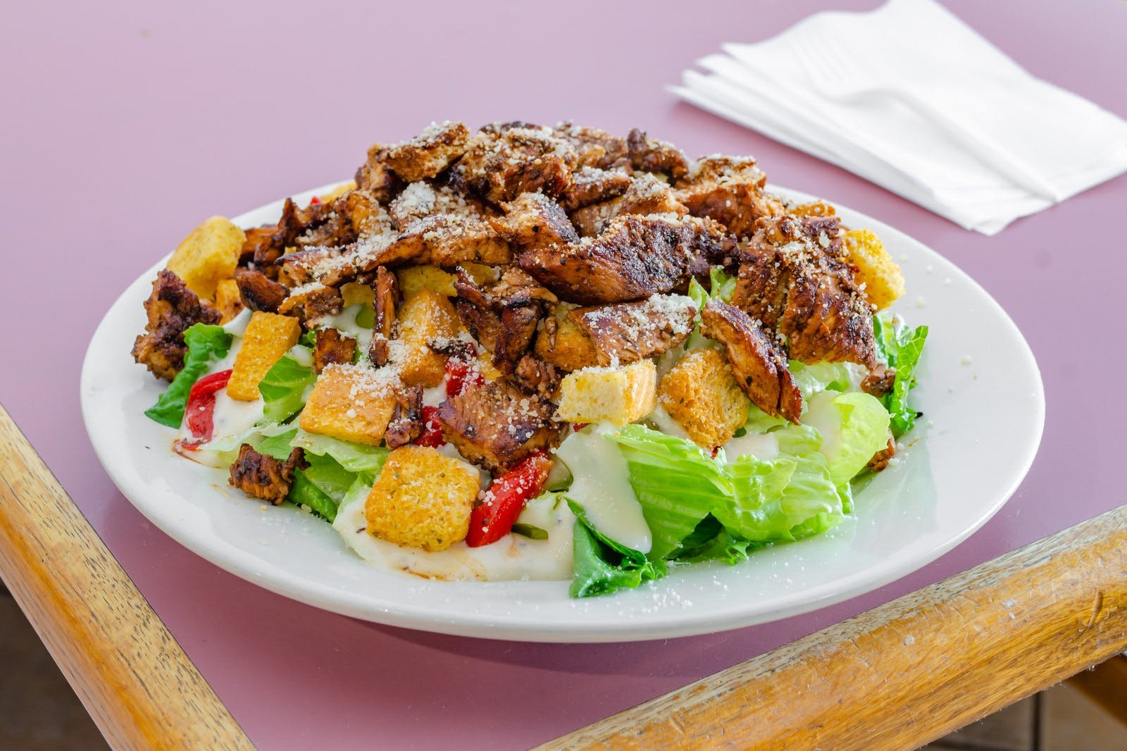 Order Grilled Marinated Chicken Caesar Salad - Small food online from Stelton Pizza store, Piscataway Township on bringmethat.com