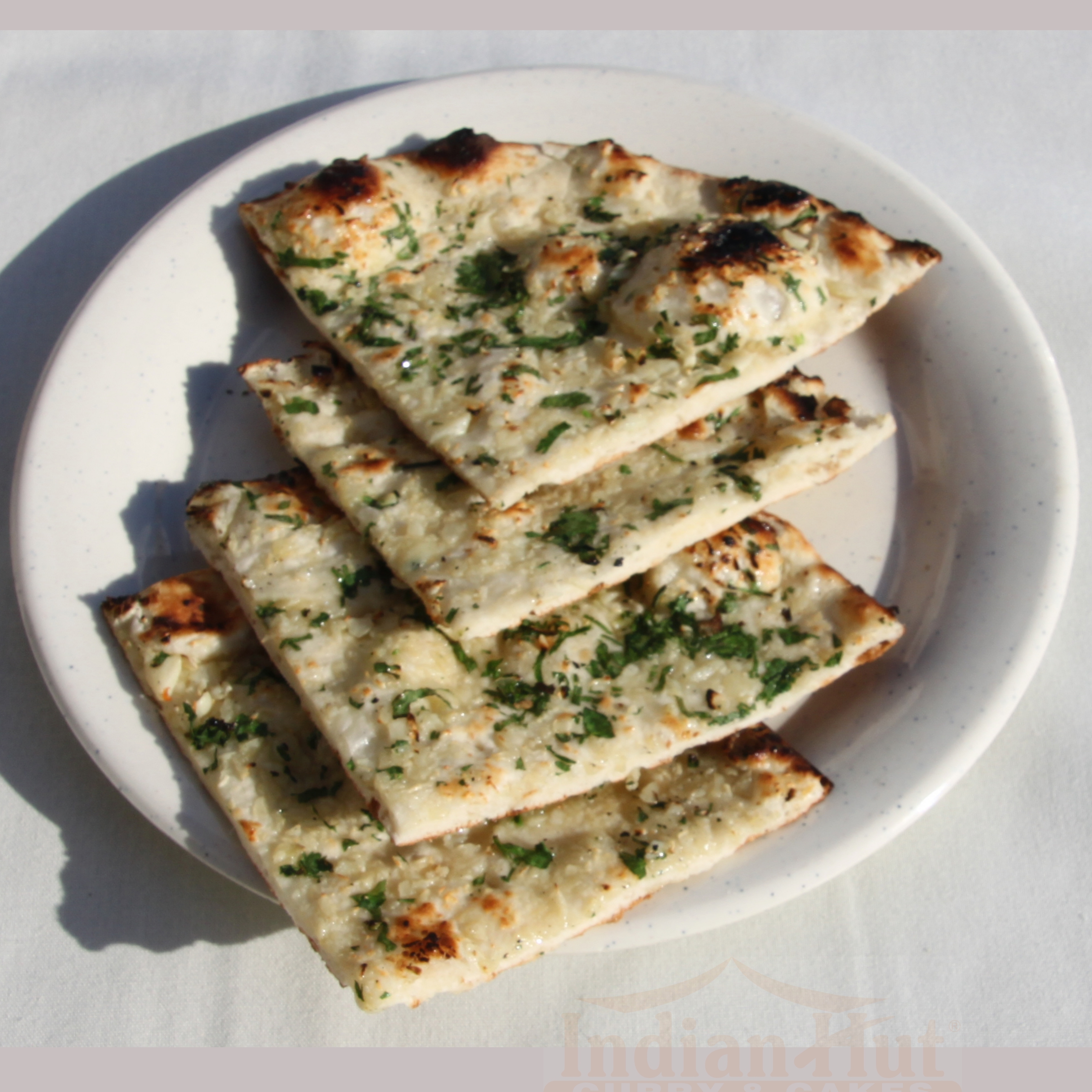 Order R2 Garlic Naan food online from Indian Hut Lawrenceville store, Lawrence Township on bringmethat.com