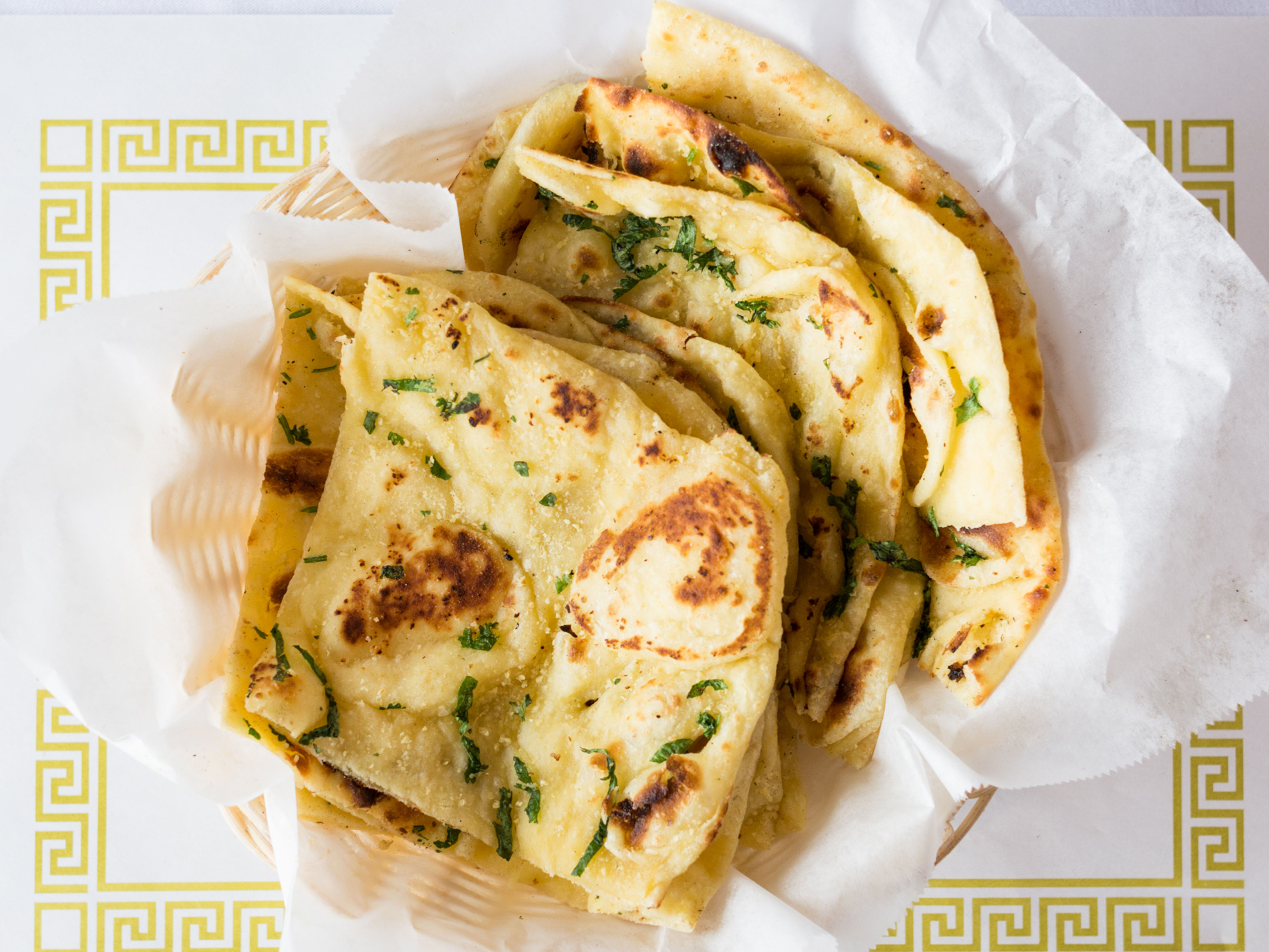 Order Garlic Naan food online from Star Of India store, Salt Lake City on bringmethat.com