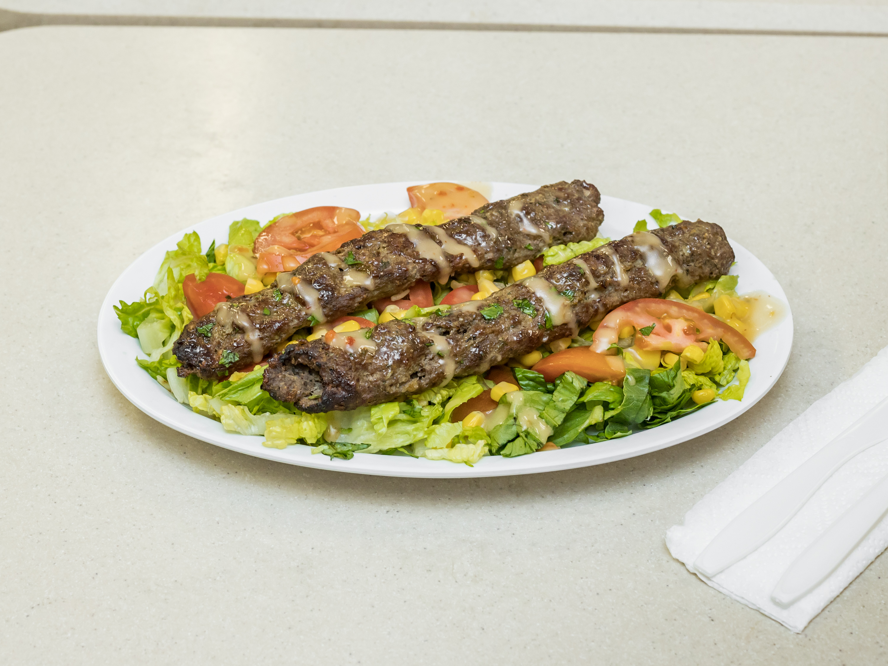 Order Kufta Salad  food online from Two Brothers Halal Market store, Houston on bringmethat.com