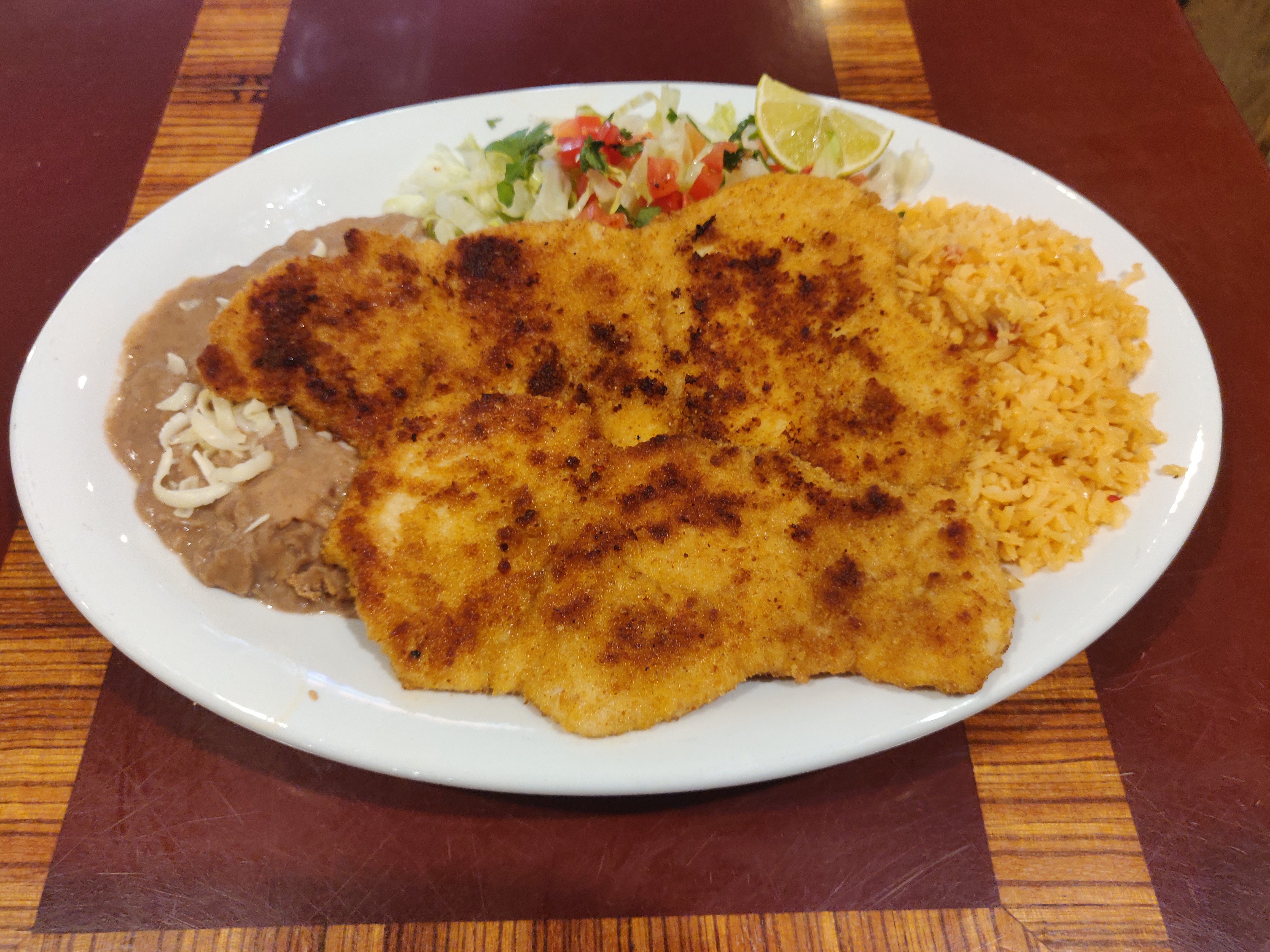 Order Breaded Chicken Breast Dinner food online from Taqueria El Ranchito store, Chicago on bringmethat.com