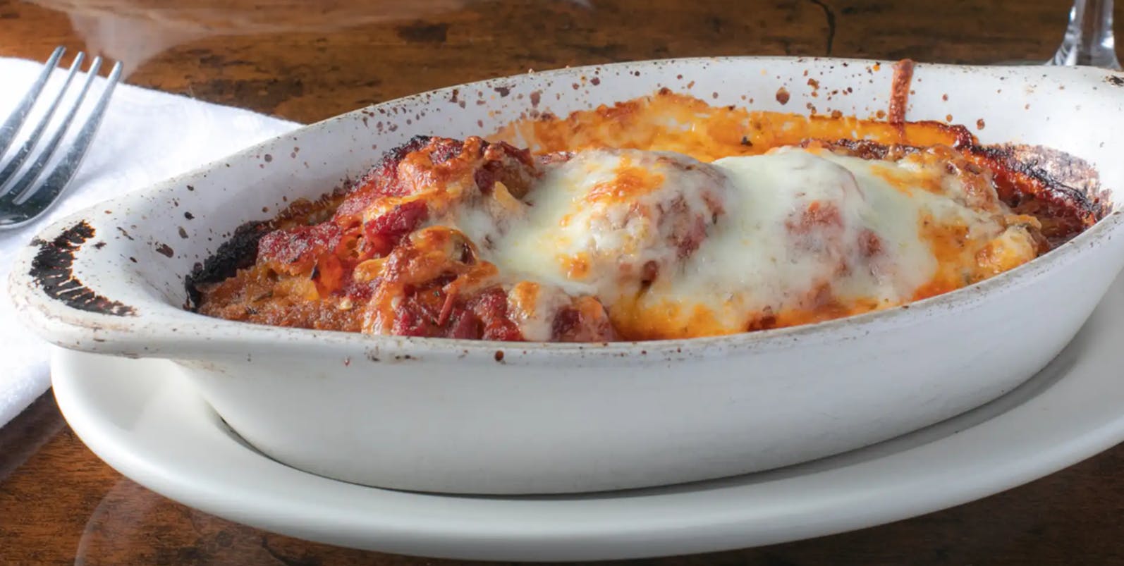 Order Baked Eggplant Parmigiana - Entree food online from Tuscany Italian Bistro store, Lake Worth on bringmethat.com