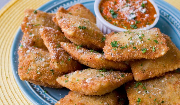 Order Toasted Beef Ravioli - 12 Pieces food online from Greek's Pizzeria store, Portland on bringmethat.com