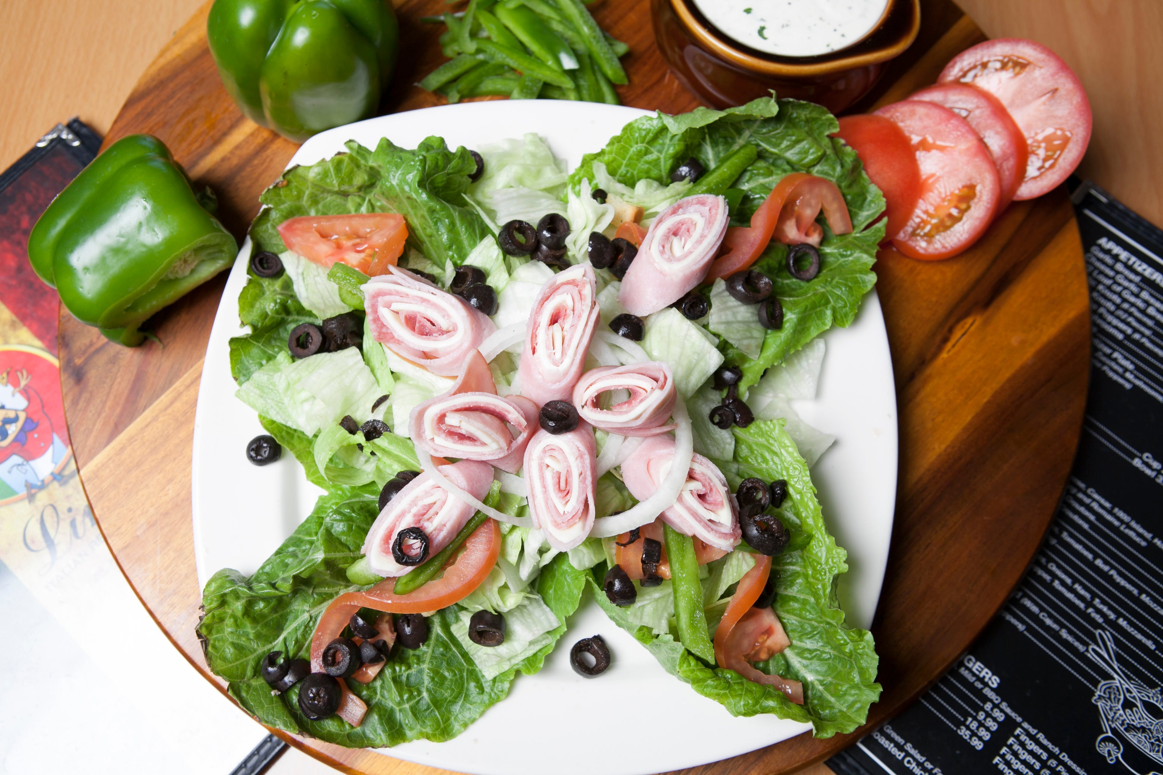 Order Antipasto Salad - Serves 1 Person food online from Lino's Pizzeria and Italian store, North Las Vegas on bringmethat.com