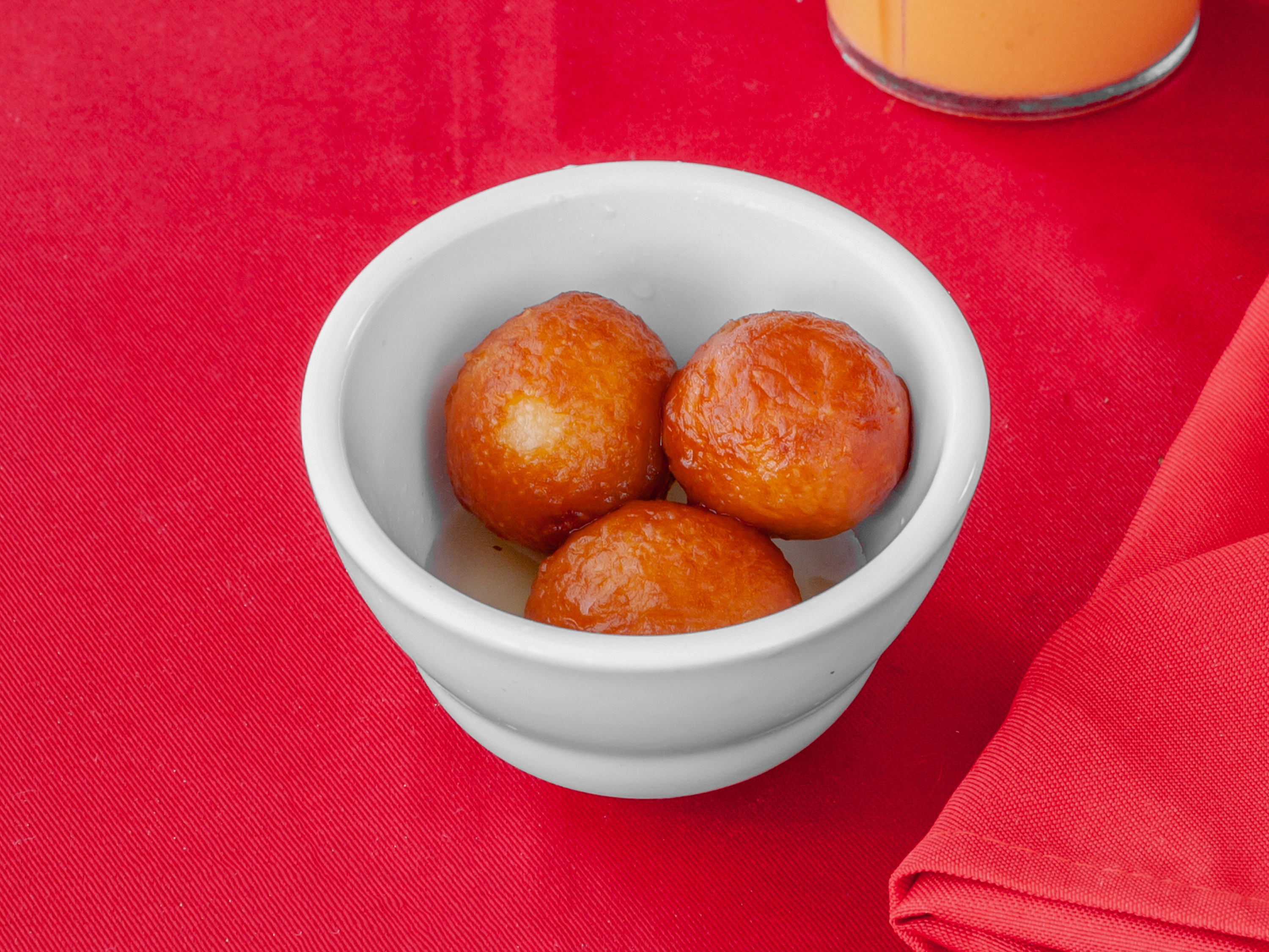Order 113. Gulab Jamun food online from Ambar Indian Restaurant store, Champaign on bringmethat.com