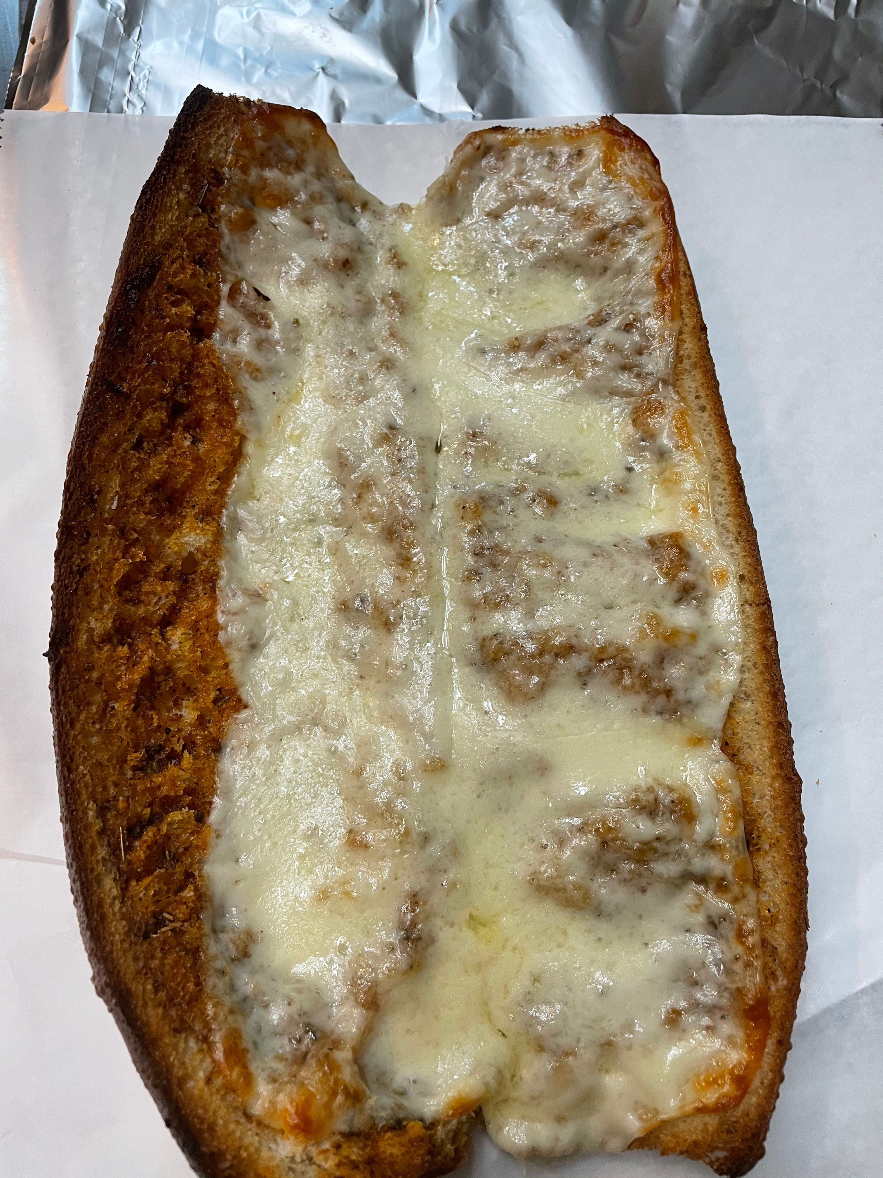 Order Garlic Bread with Cheese - Appetizer food online from Michelangelo's Pizza store, East Brunswick on bringmethat.com
