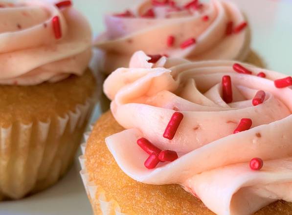 Order Vanilla-Strawberry Cupcake food online from Rum Cakes Factory store, Plano on bringmethat.com