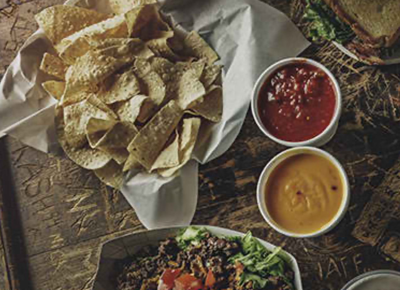 Order Chips & Queso food online from Dixie Chicken store, College Station on bringmethat.com
