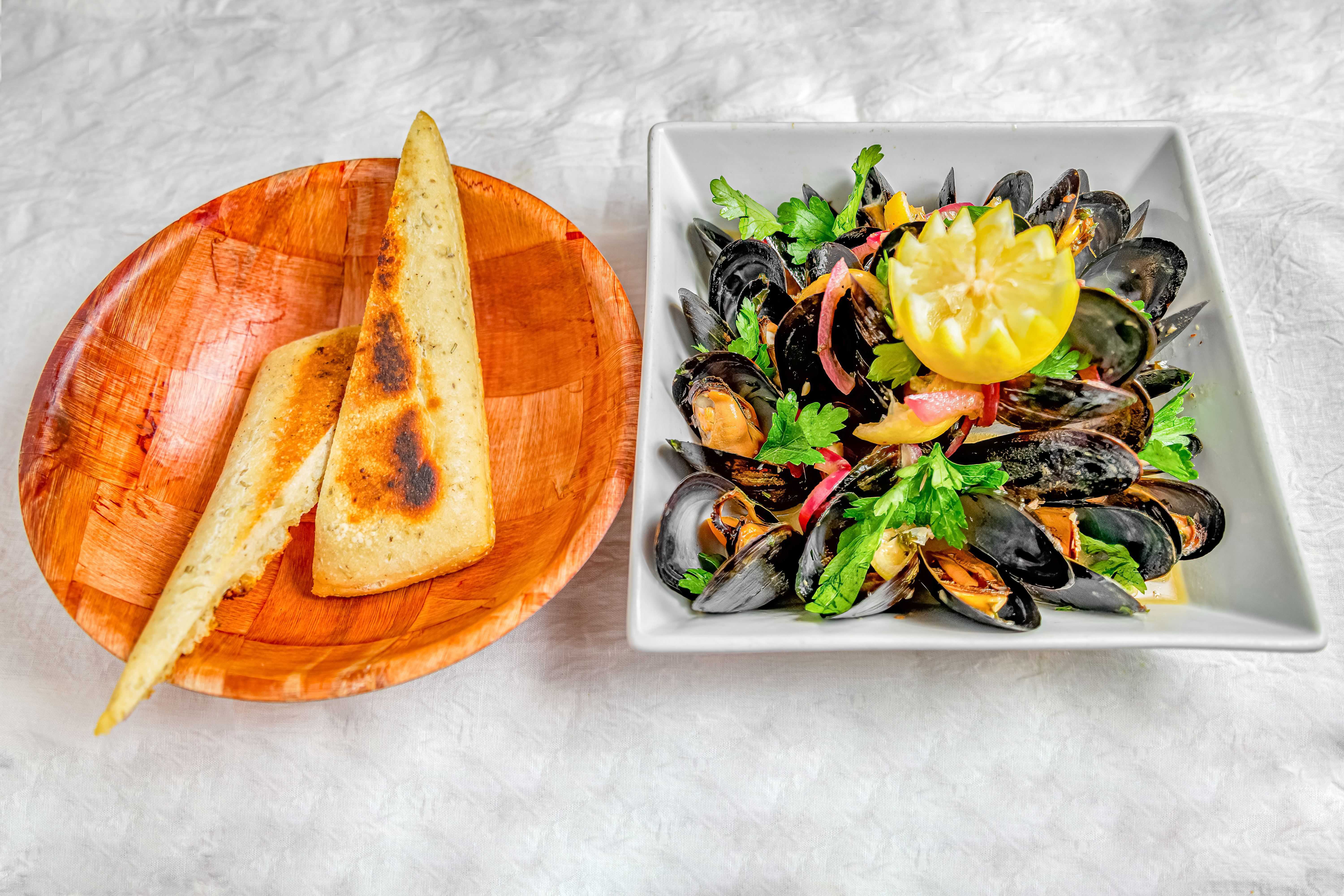 Order Pot of Mussels food online from Harlem Tavern store, New York on bringmethat.com