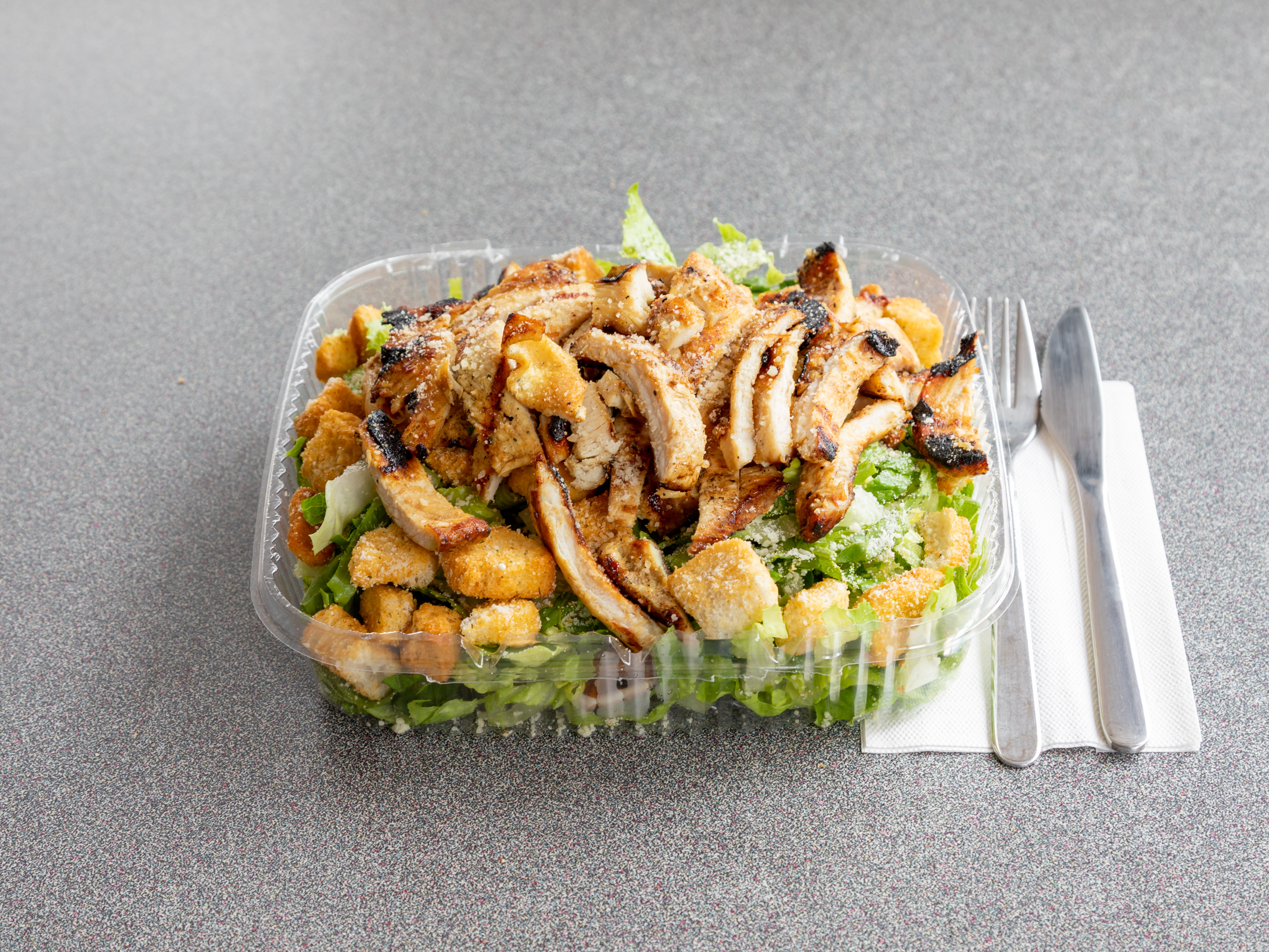 Order Caesar Salad with Grilled Chicken food online from Scala Pizza store, Mount Vernon on bringmethat.com