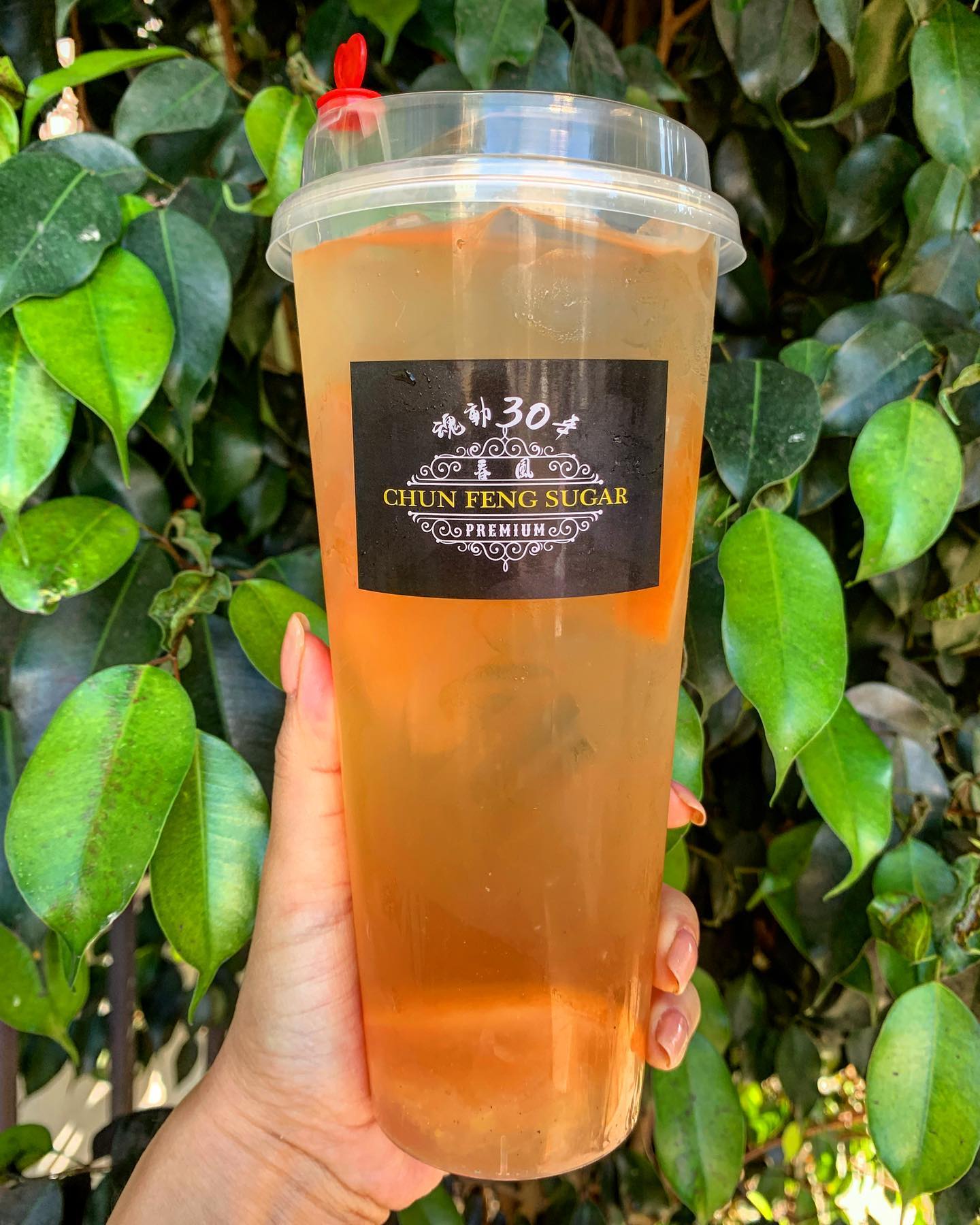 Order 22 oz. Passion Fruit Green Tea food online from Chun Feng Sugar store, Los Angeles on bringmethat.com