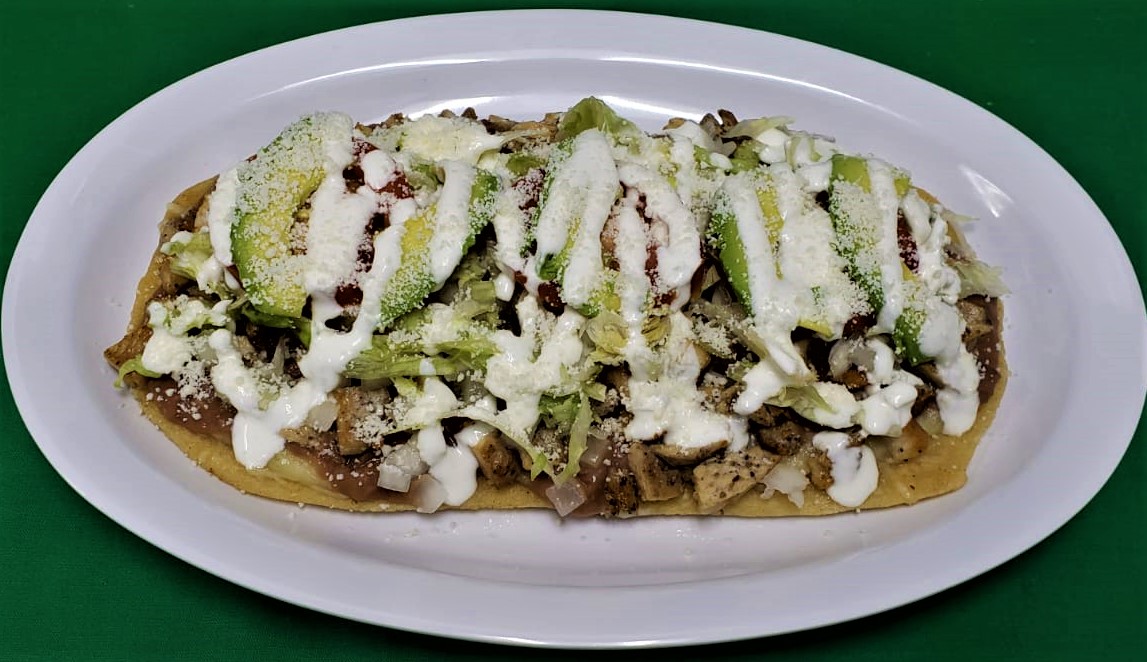 Order Huarache (1) food online from 3 Aguilas Taqueria store, Denton on bringmethat.com