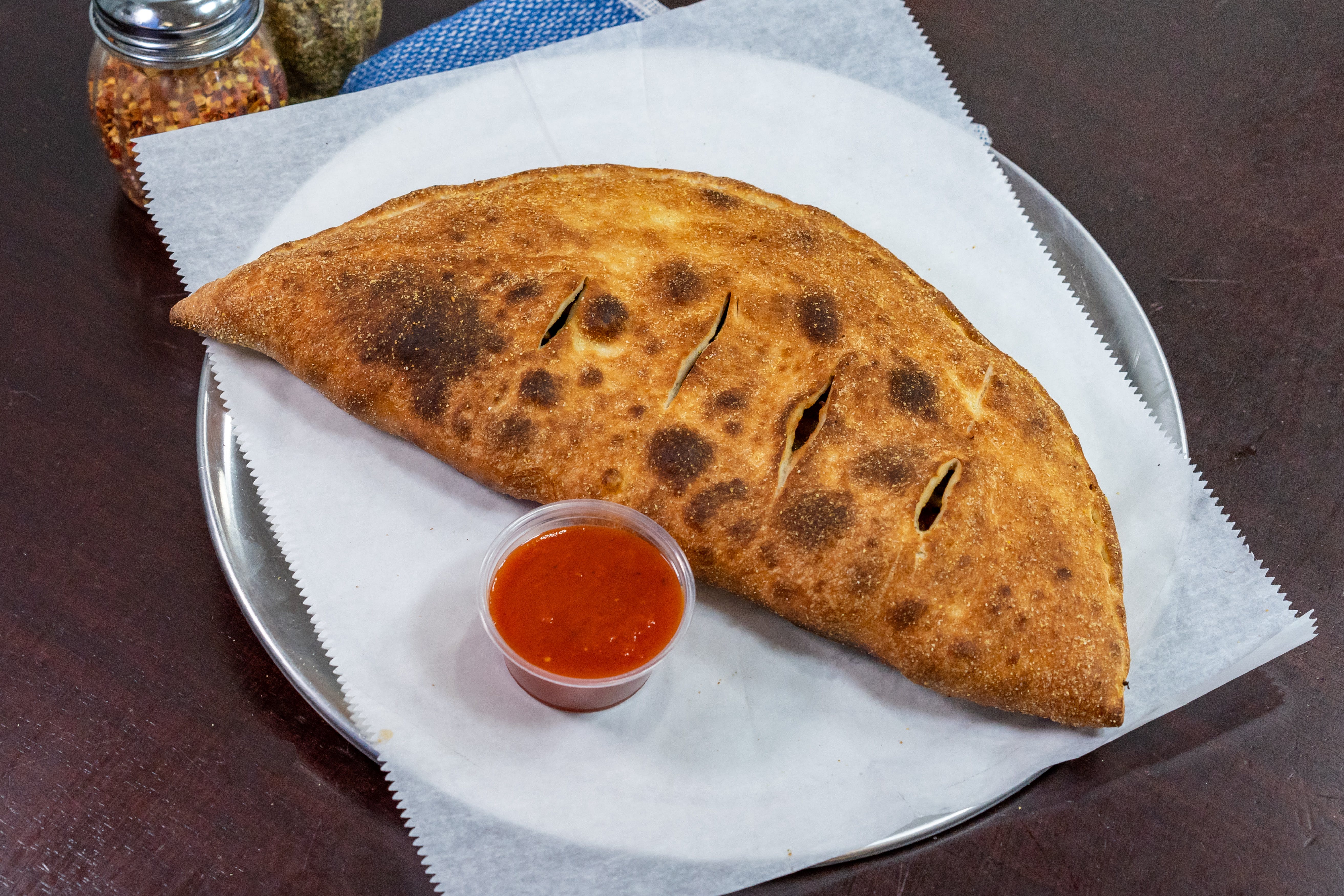 Order Calzone - Calzone food online from Andriano's Pizza store, Delmar on bringmethat.com