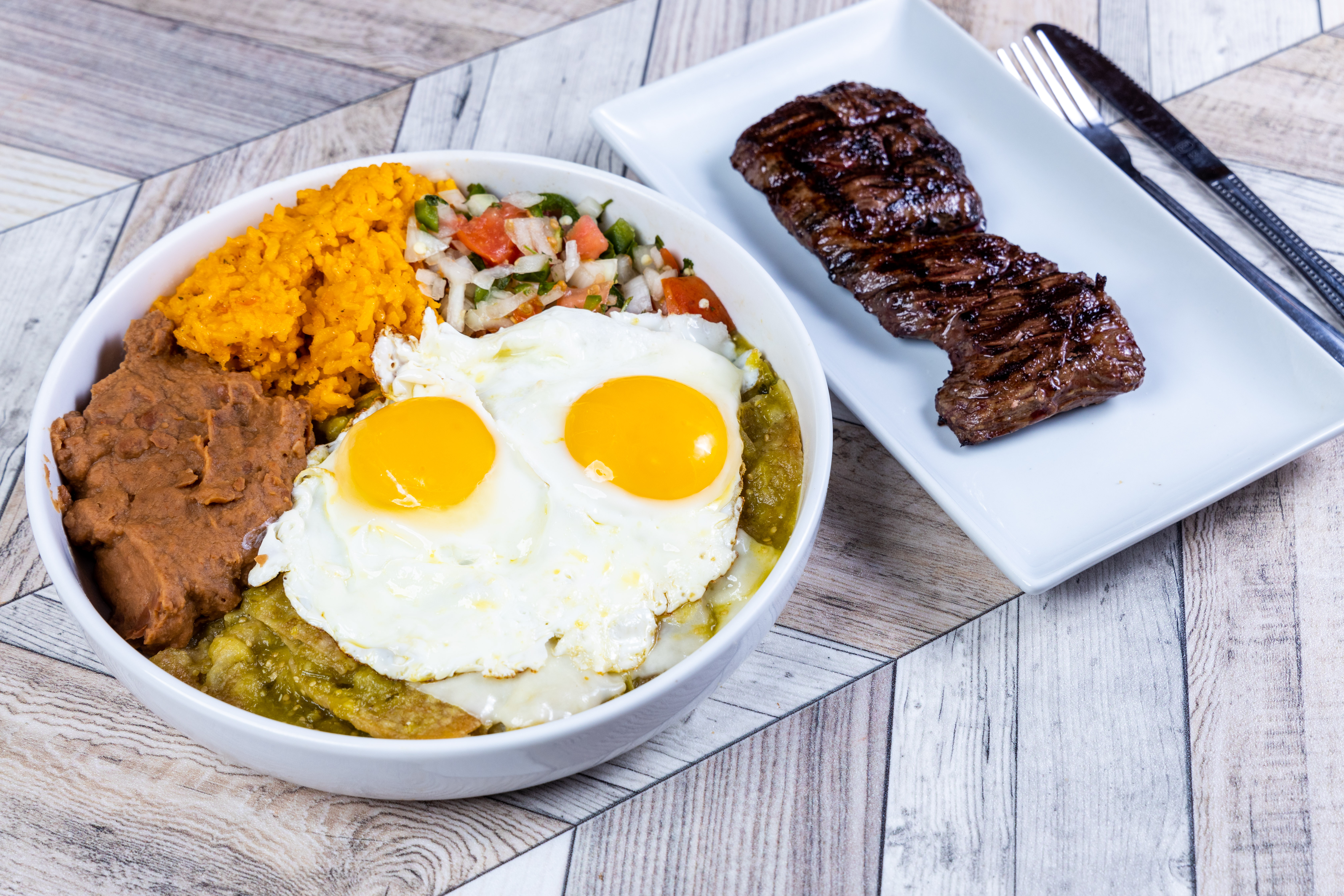 Order Huevos Chilaquiles with Steak food online from Top View Restaurant store, Chicago on bringmethat.com