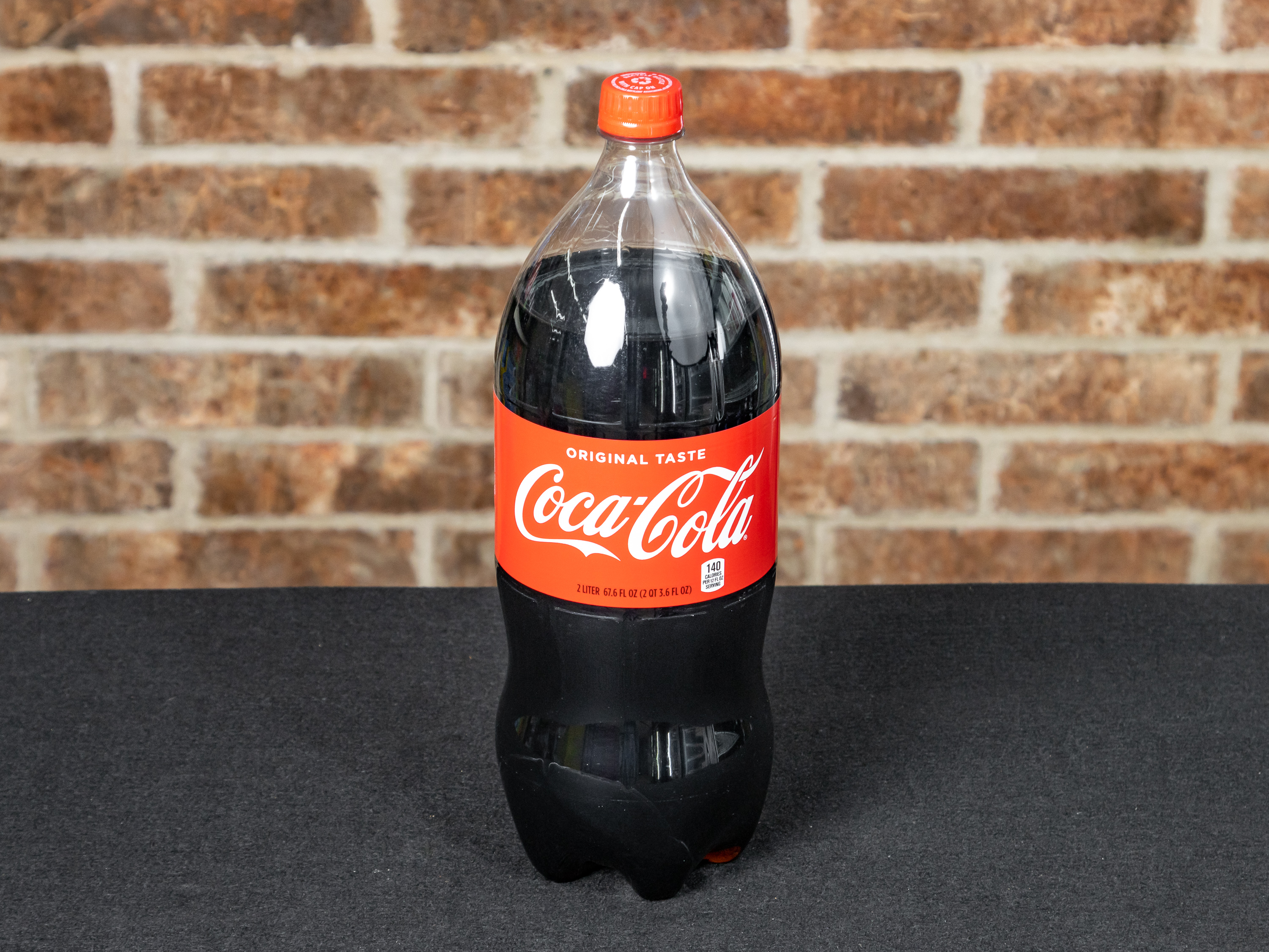 Order 2 Liter Coca-Cola Original food online from Handy Mart store, Mckinney on bringmethat.com
