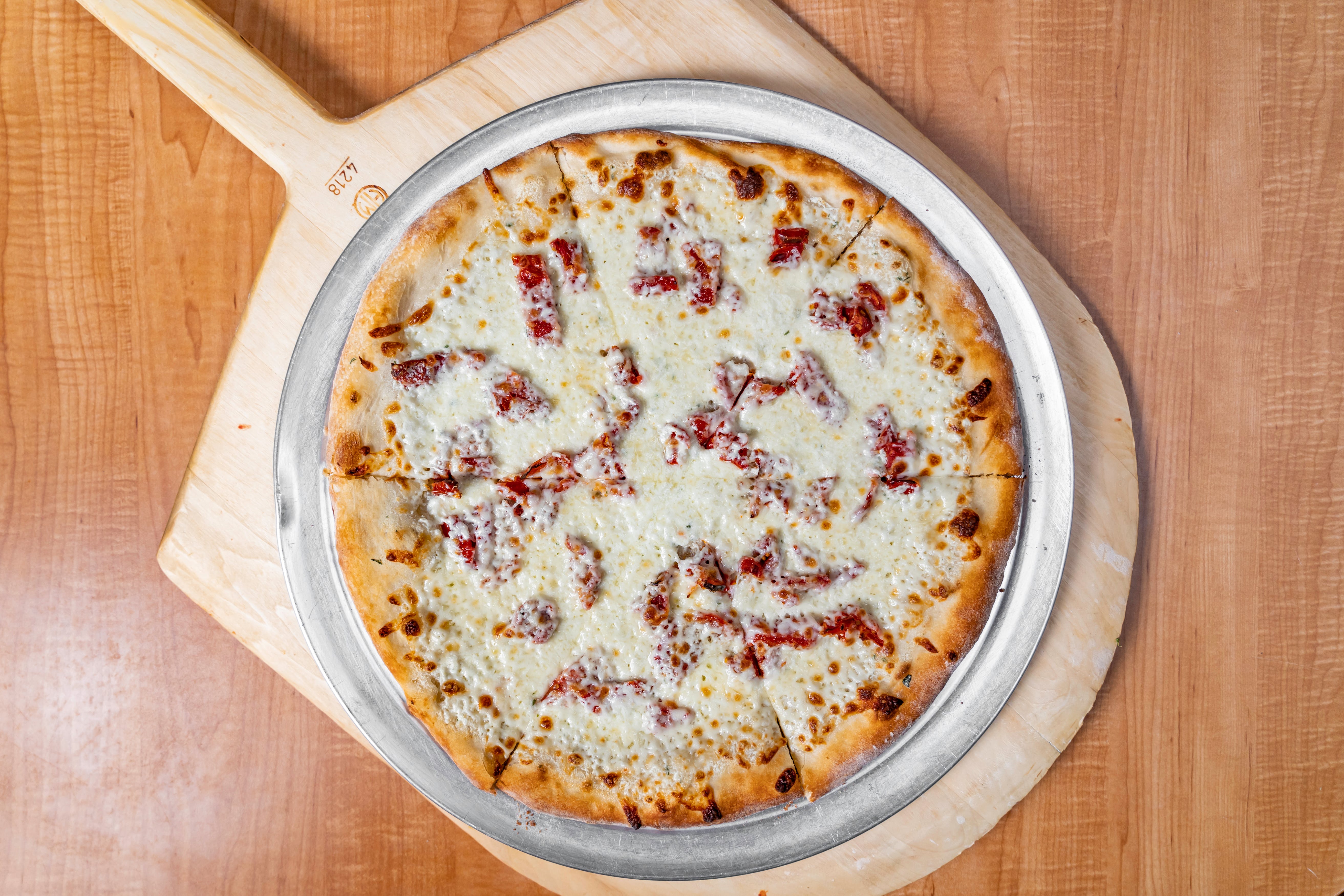 Order White Pizza - Personal 10" food online from Luigi Italian Restaurant store, Hondo on bringmethat.com