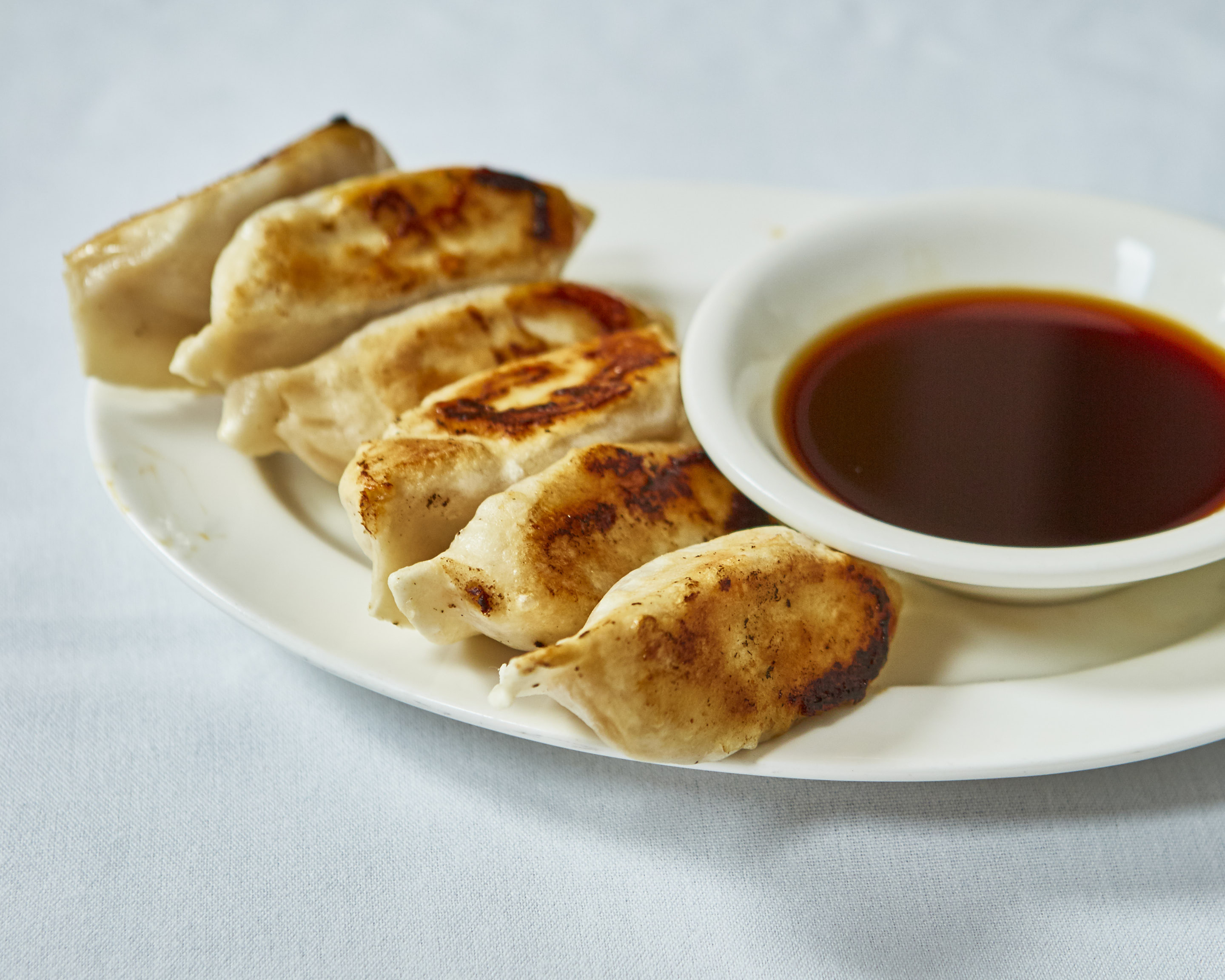 Order 26. Pan-Fried Dumplings food online from Ollie's Sichuan store, New York on bringmethat.com