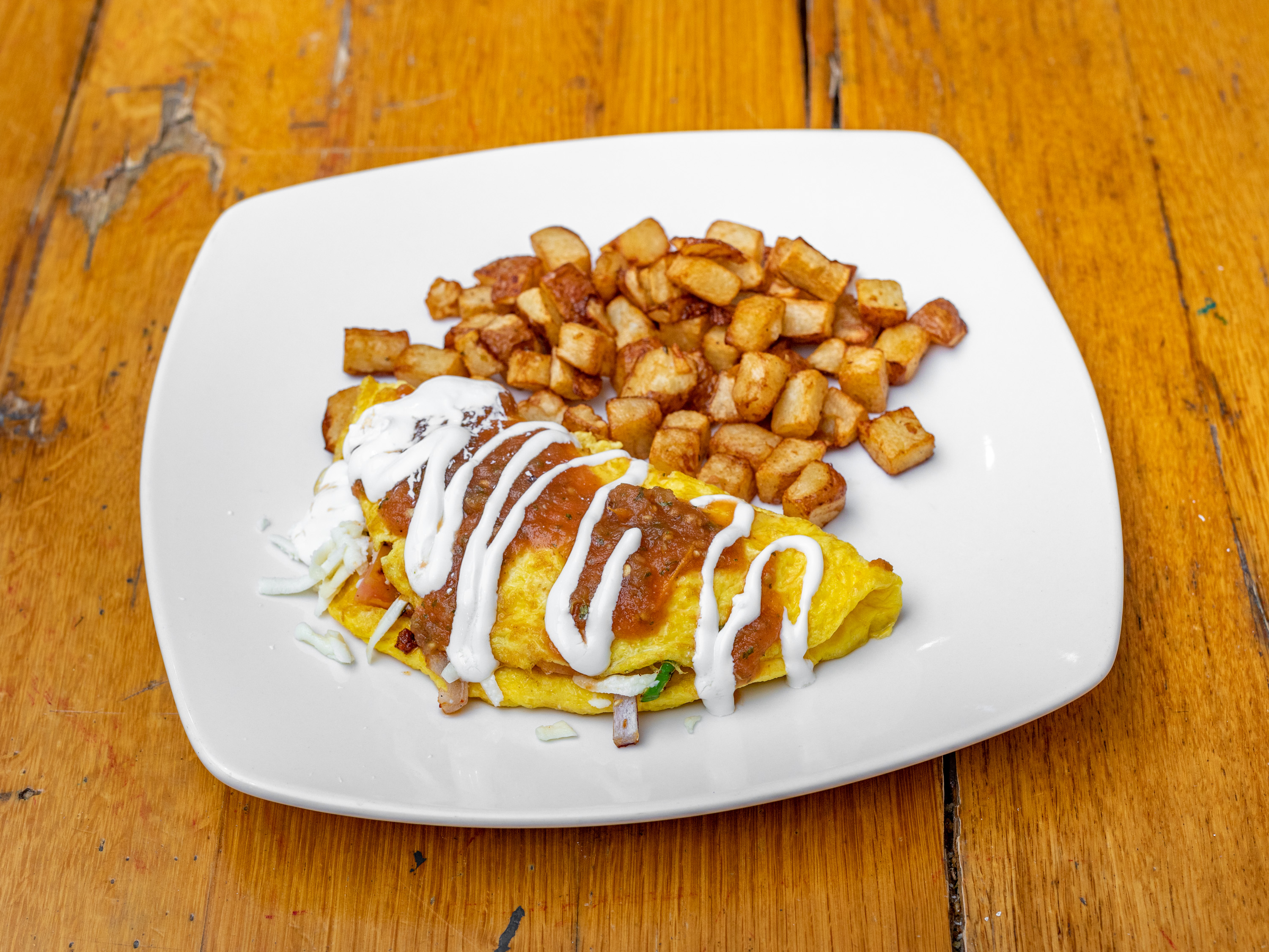Order RANCHERO OMELETTE food online from Thiago's Restaurant store, Chicago on bringmethat.com
