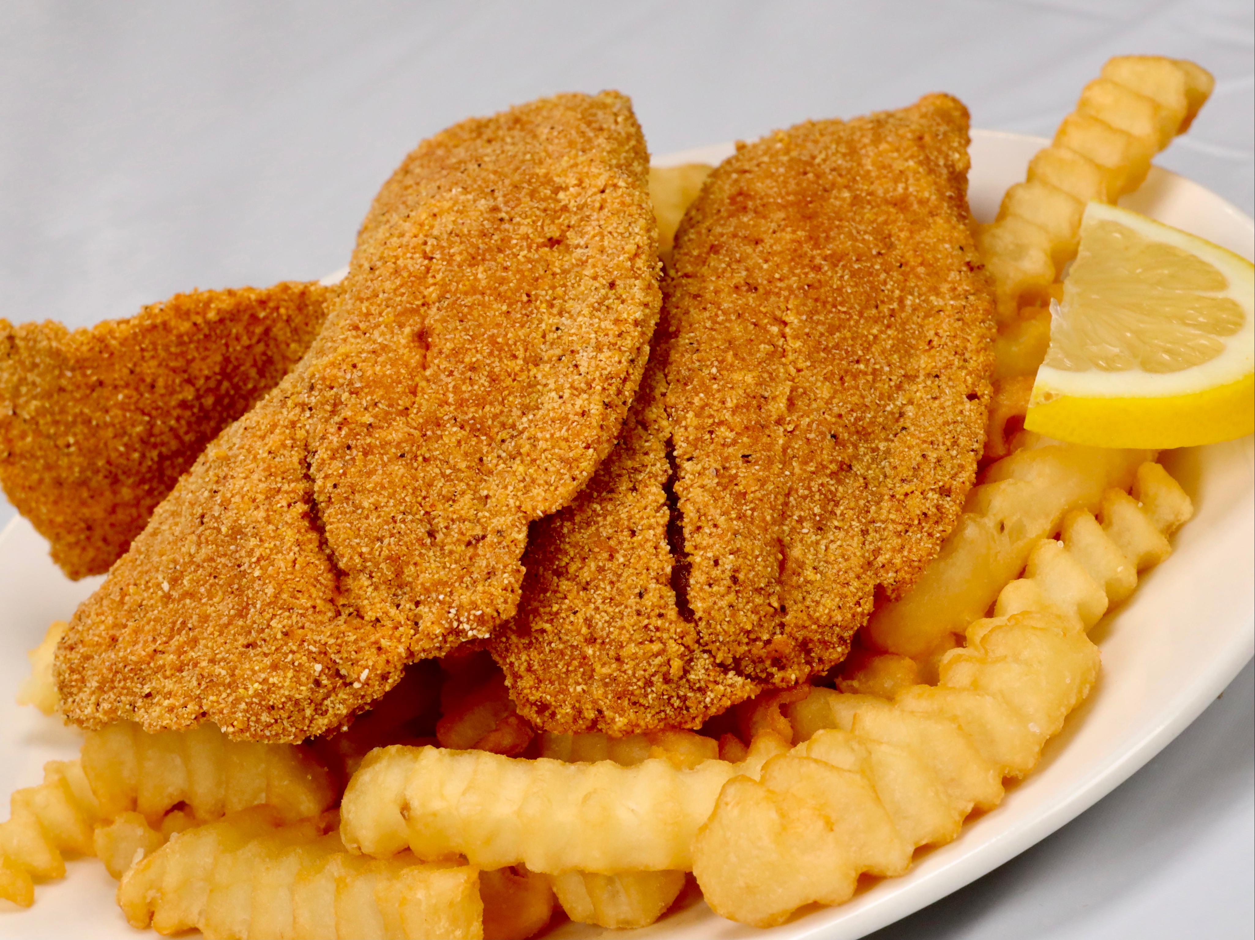 Order 2pc Tilapia and Fry food online from Sam Sylks Chicken & Fish store, South Euclid on bringmethat.com