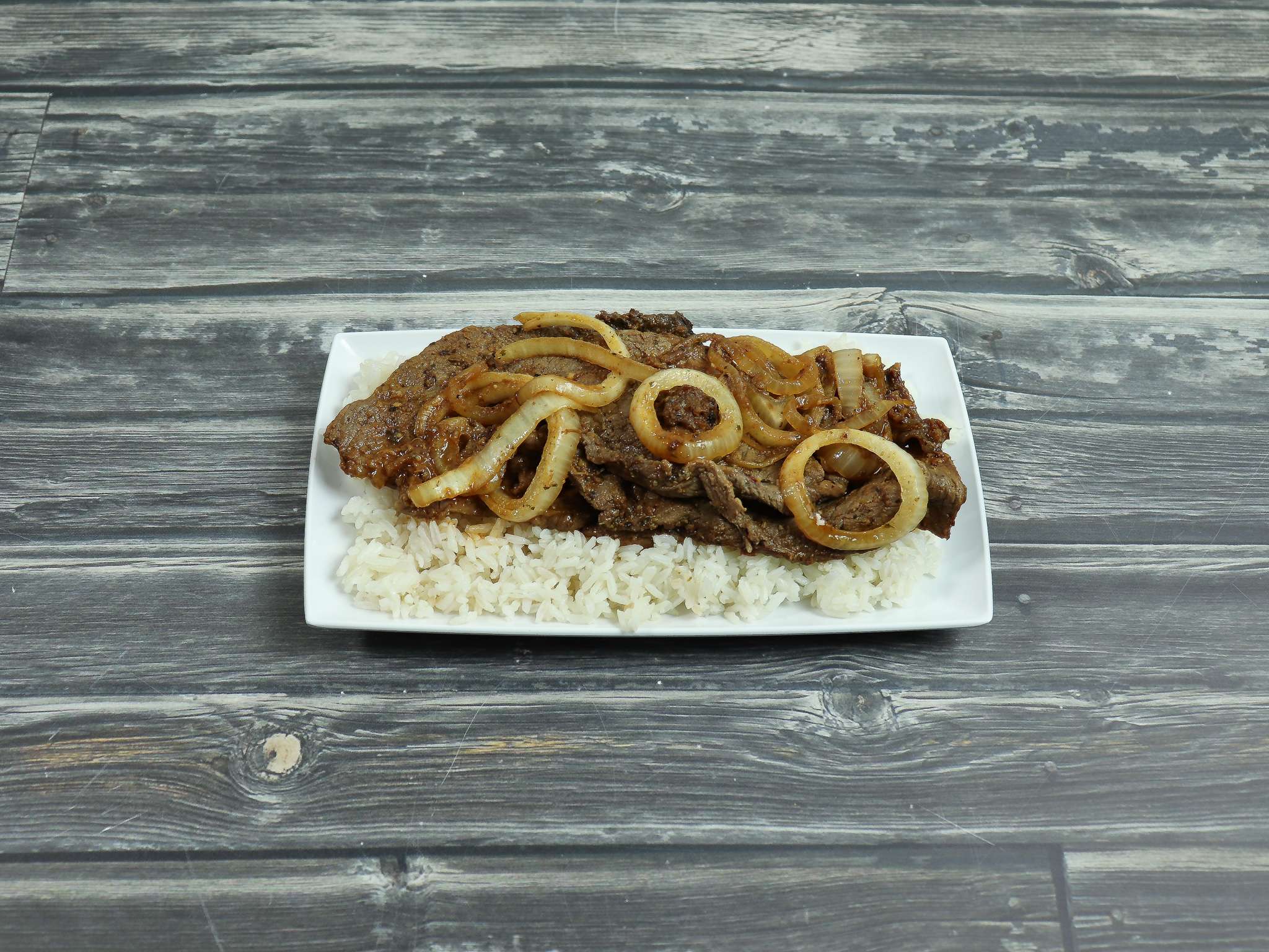 Order 9. Bistec with Onions food online from Coqui Restaurant store, Lilburn on bringmethat.com