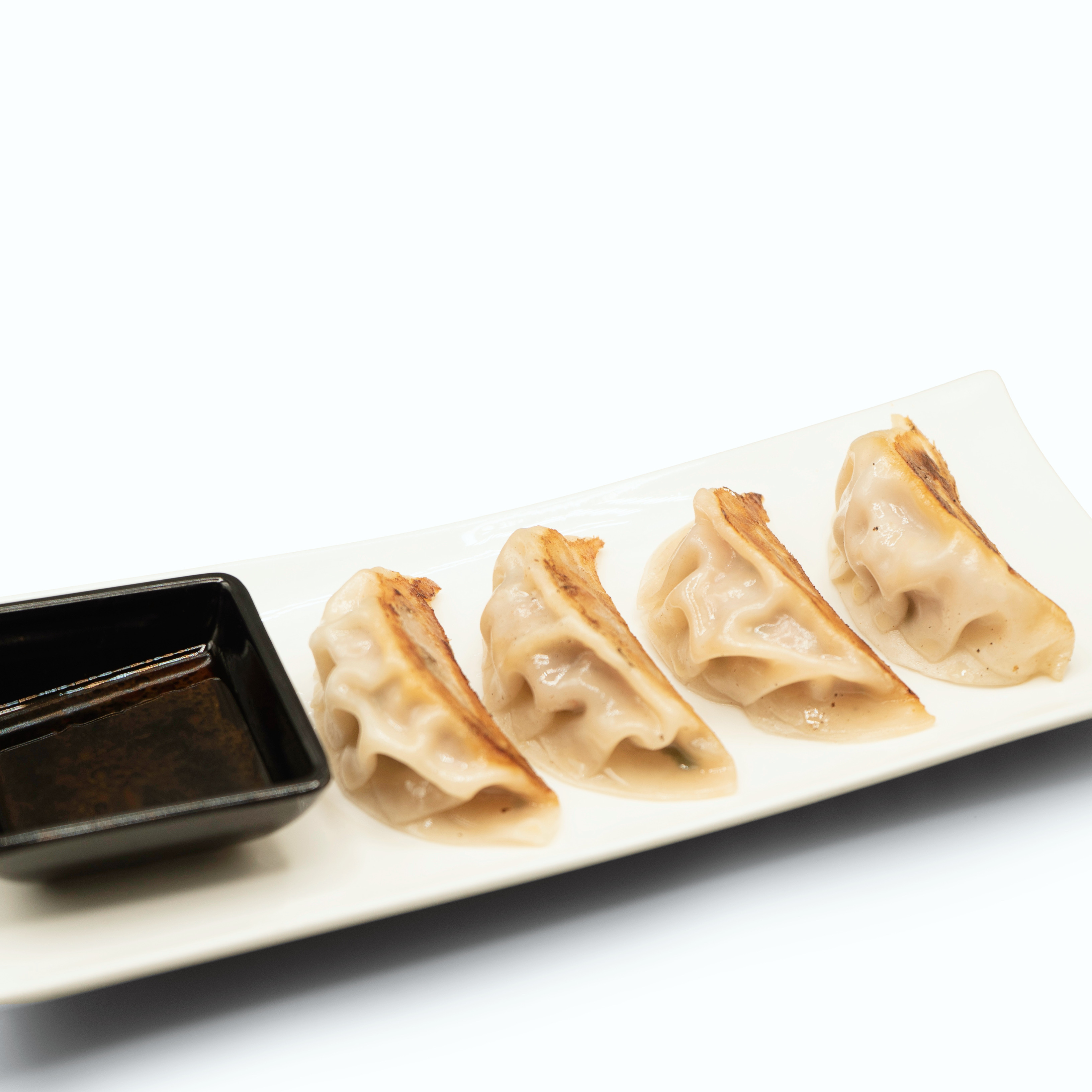 Order Pan Fried Gyoza (Chicken) food online from Zutto Japanese American Pub store, New York on bringmethat.com