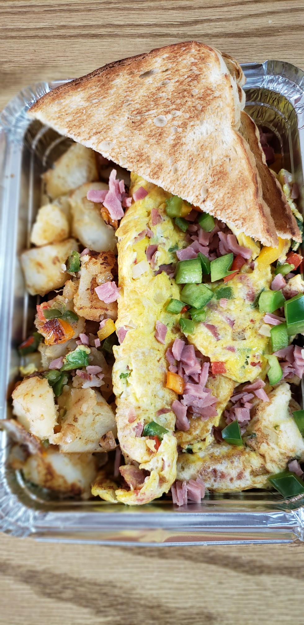 Order Western Omelet Platter (eggs ham onions bell peppers & your choice of cheese) food online from American Gourmet Foods Deli store, New York on bringmethat.com