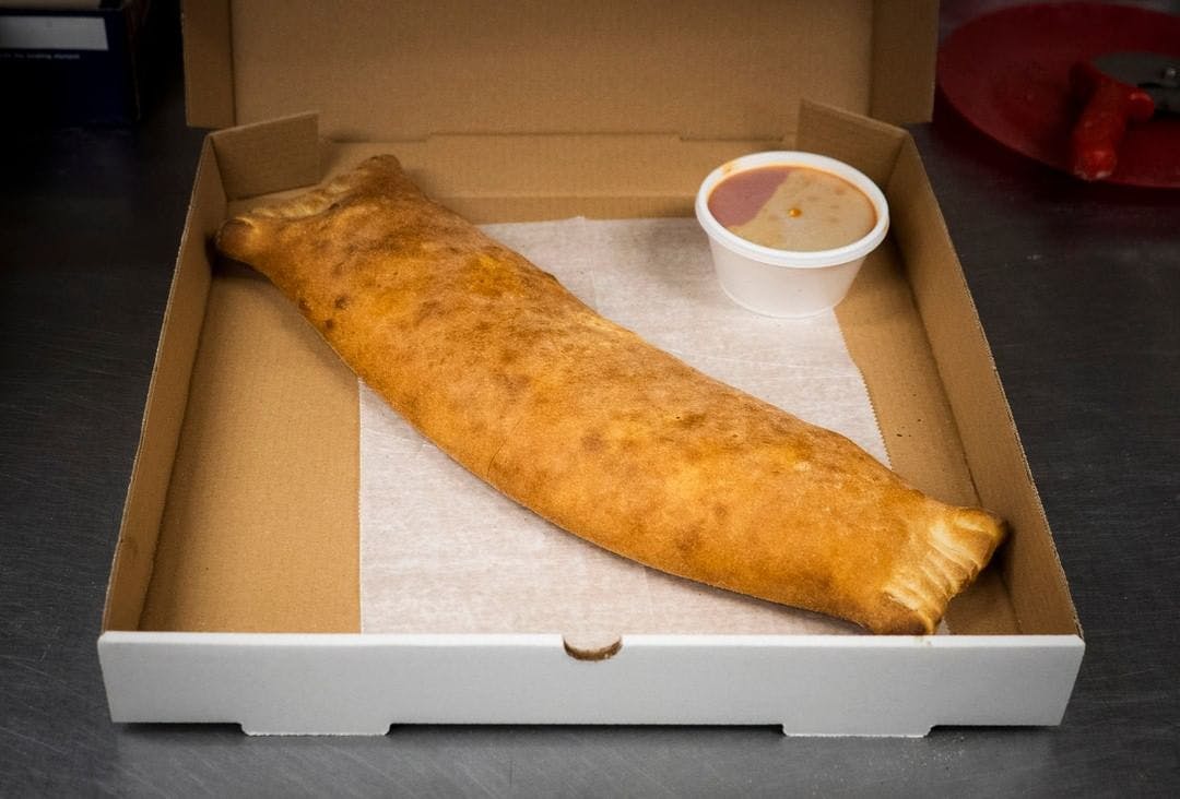 Order Buffalo Chicken Calzone - Small 12'' food online from A1 Brick Oven Pizza store, Vernon Rockville on bringmethat.com
