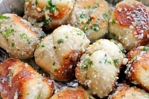Order Garlic Knots - 4 Pieces food online from Little Italy Pizza store, Brooklyn on bringmethat.com
