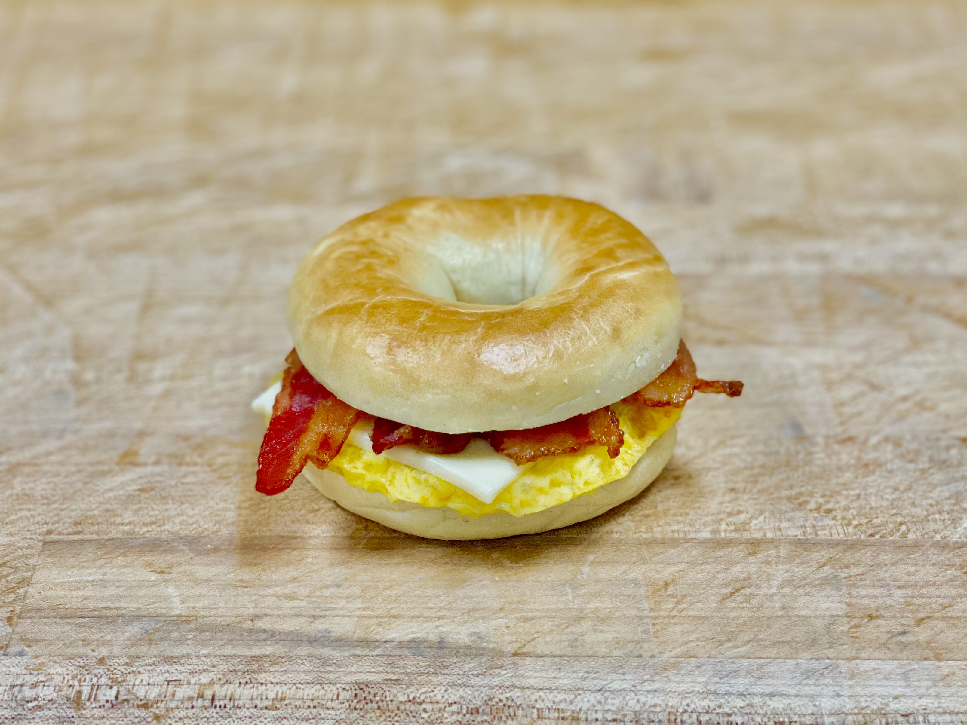 Order B-11 Bacon & Egg & Cheese Bagel food online from K-Inn Donuts store, Paramount on bringmethat.com