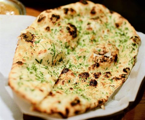 Order Garlic Naan food online from Empyrean Indian Kitchen store, Hoboken on bringmethat.com