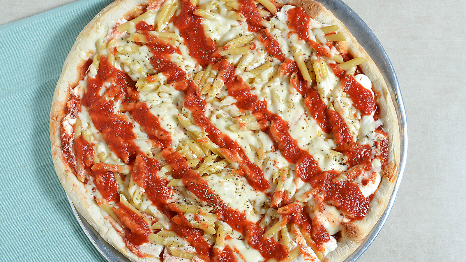 Order Baked Ziti Pizza food online from Mario's Pizzeria store, Oyster Bay on bringmethat.com