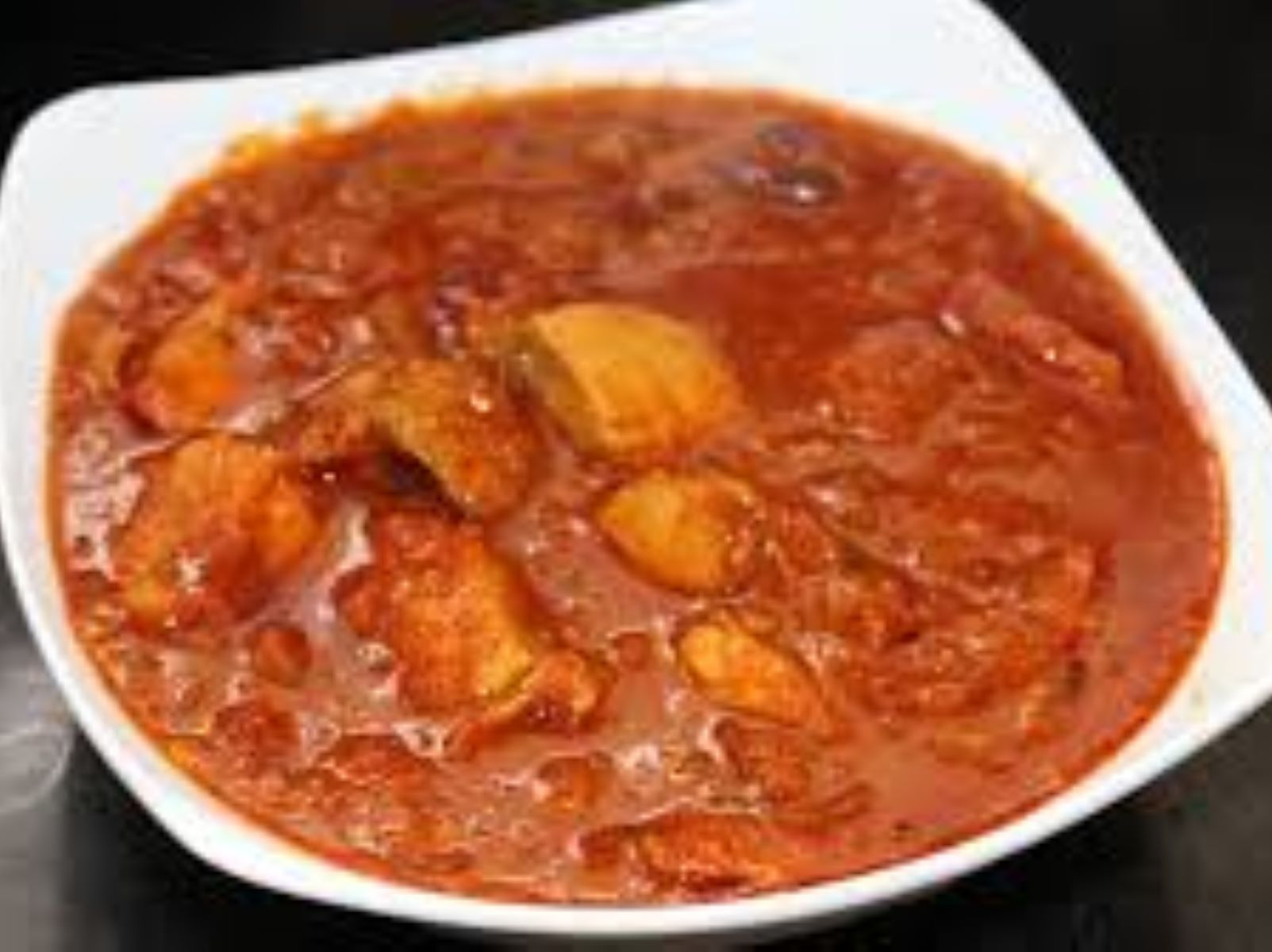 Order Fish Vindaloo food online from Passage to India store, Cambridge on bringmethat.com