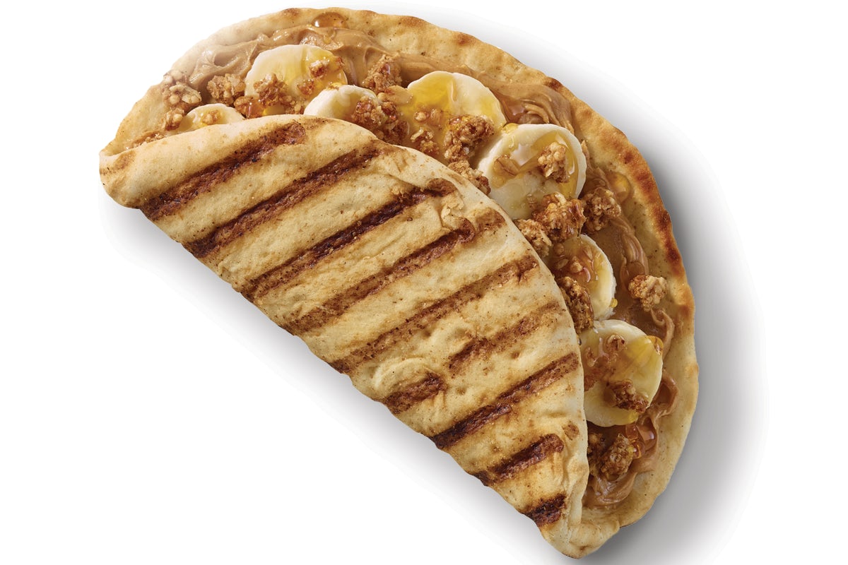 Order PEANUT BUTTER BANANA CRUNCH FLATBREAD food online from Tropical Smoothie Cafe store, McAllen on bringmethat.com