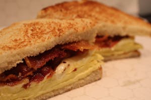 Order BACON EGG CHEESE ON TOAST food online from Millers Country Kitchen store, Middletown on bringmethat.com