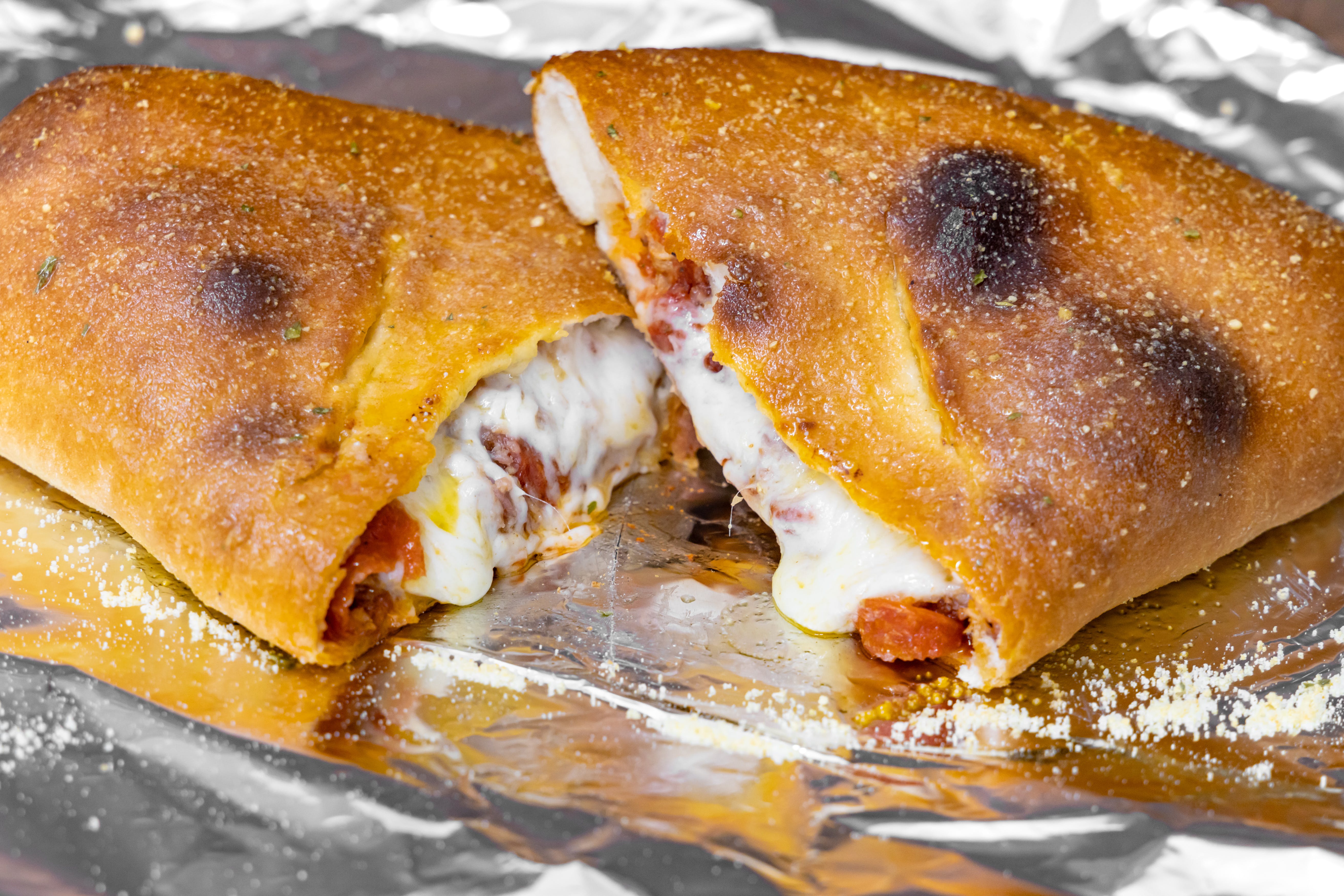 Order Build Your Own Calzone - Calzone food online from Fabiano's Grocery & Deli store, Grand Ledge on bringmethat.com