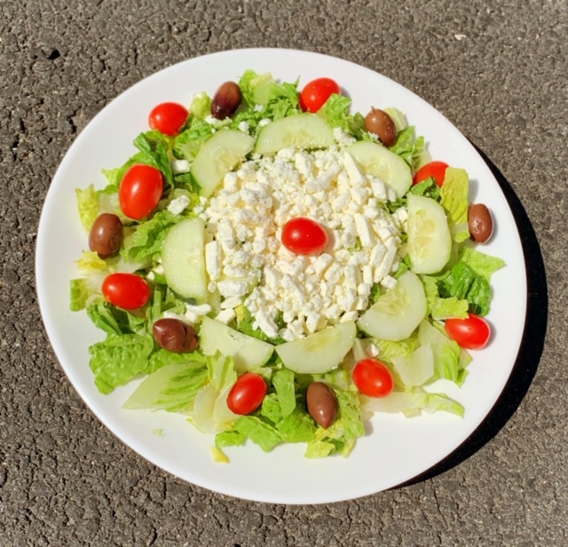 Order Greek Salad food online from Nino's Pizza & Restaurant store, Hillsdale on bringmethat.com