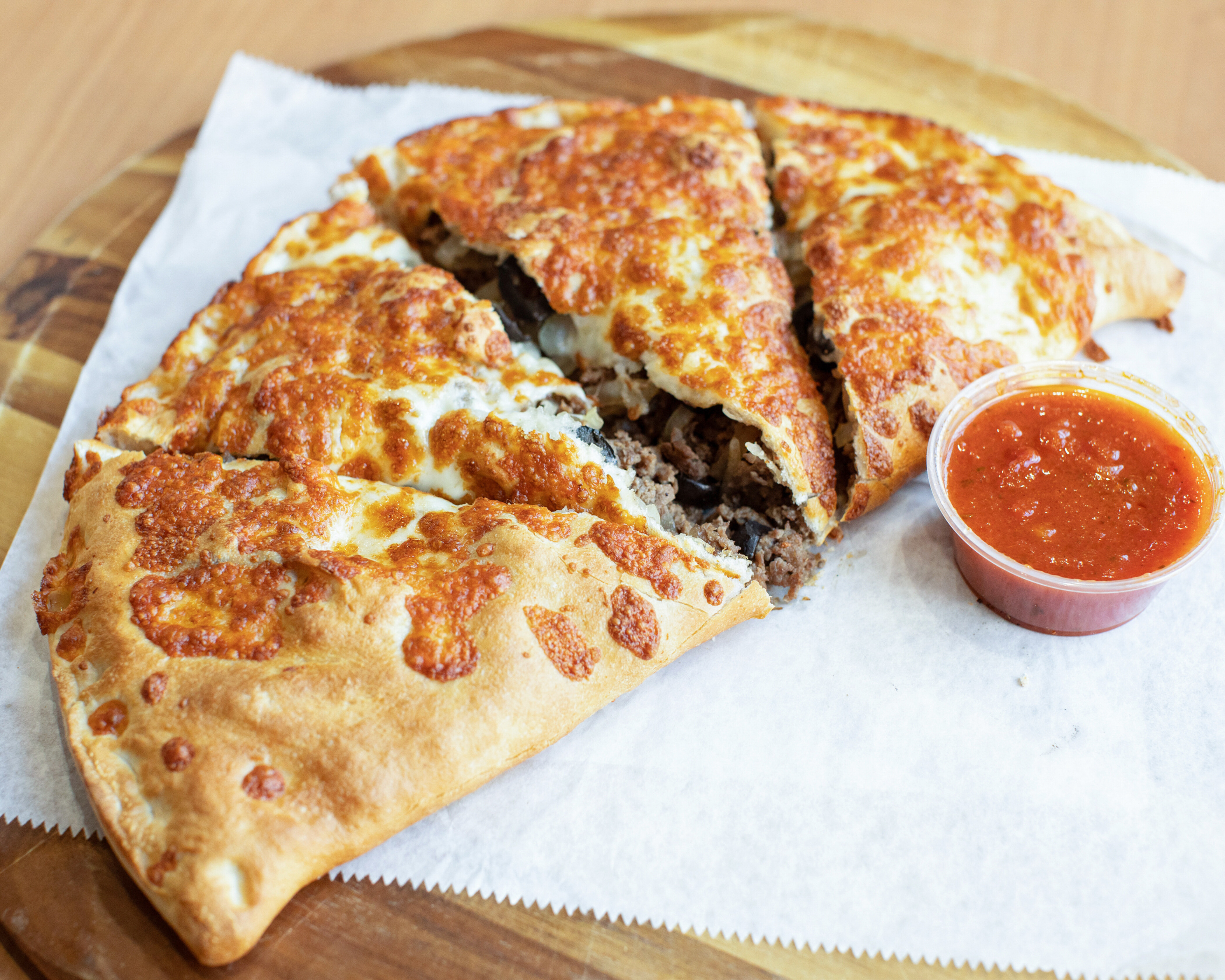 Order Steak and Cheese Calzone food online from Mark Pizza & Subs store, Wellesley on bringmethat.com