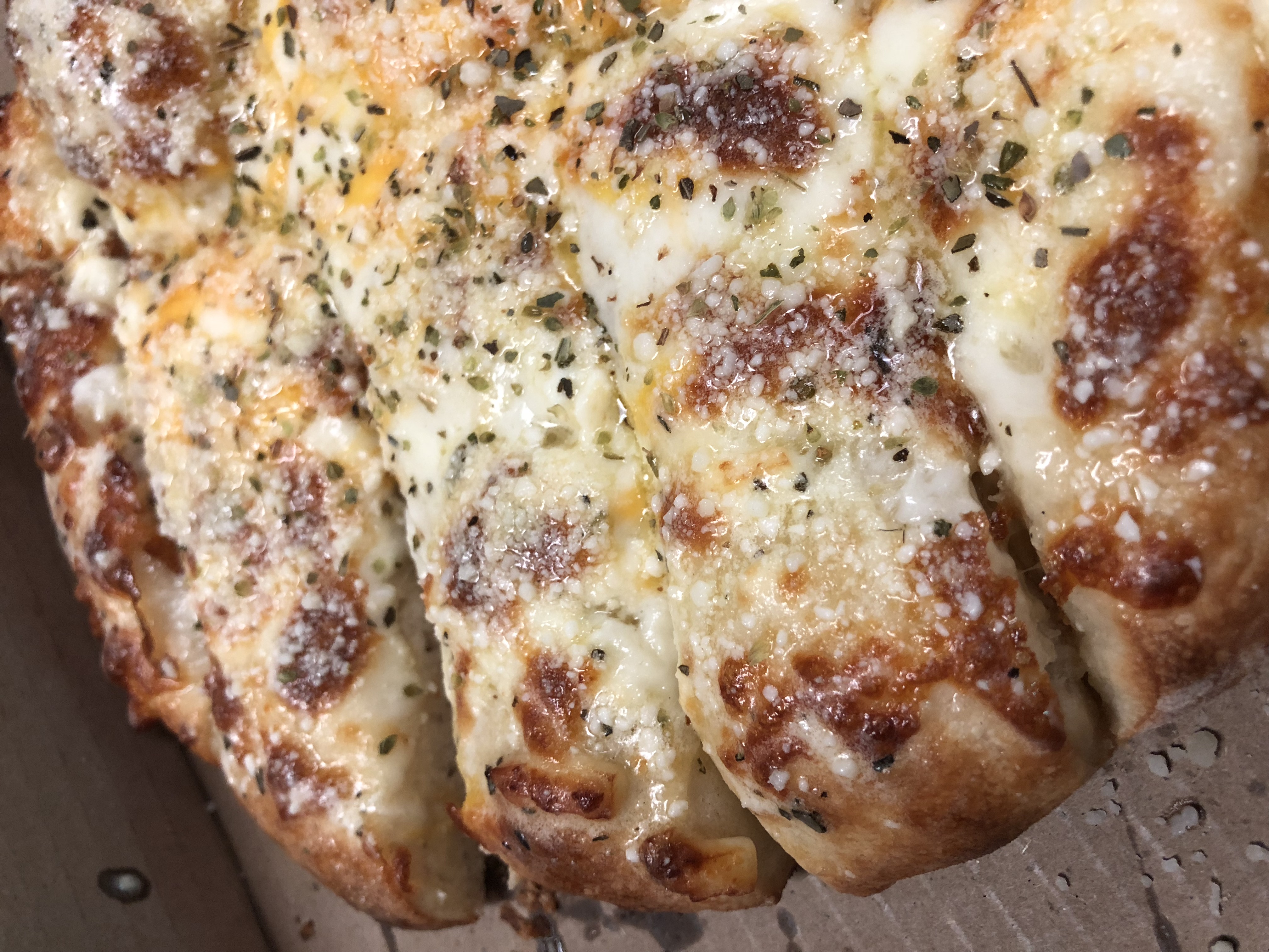 Order Bread Sticks w/Cheese food online from Romas Pizza store, Kalamazoo on bringmethat.com