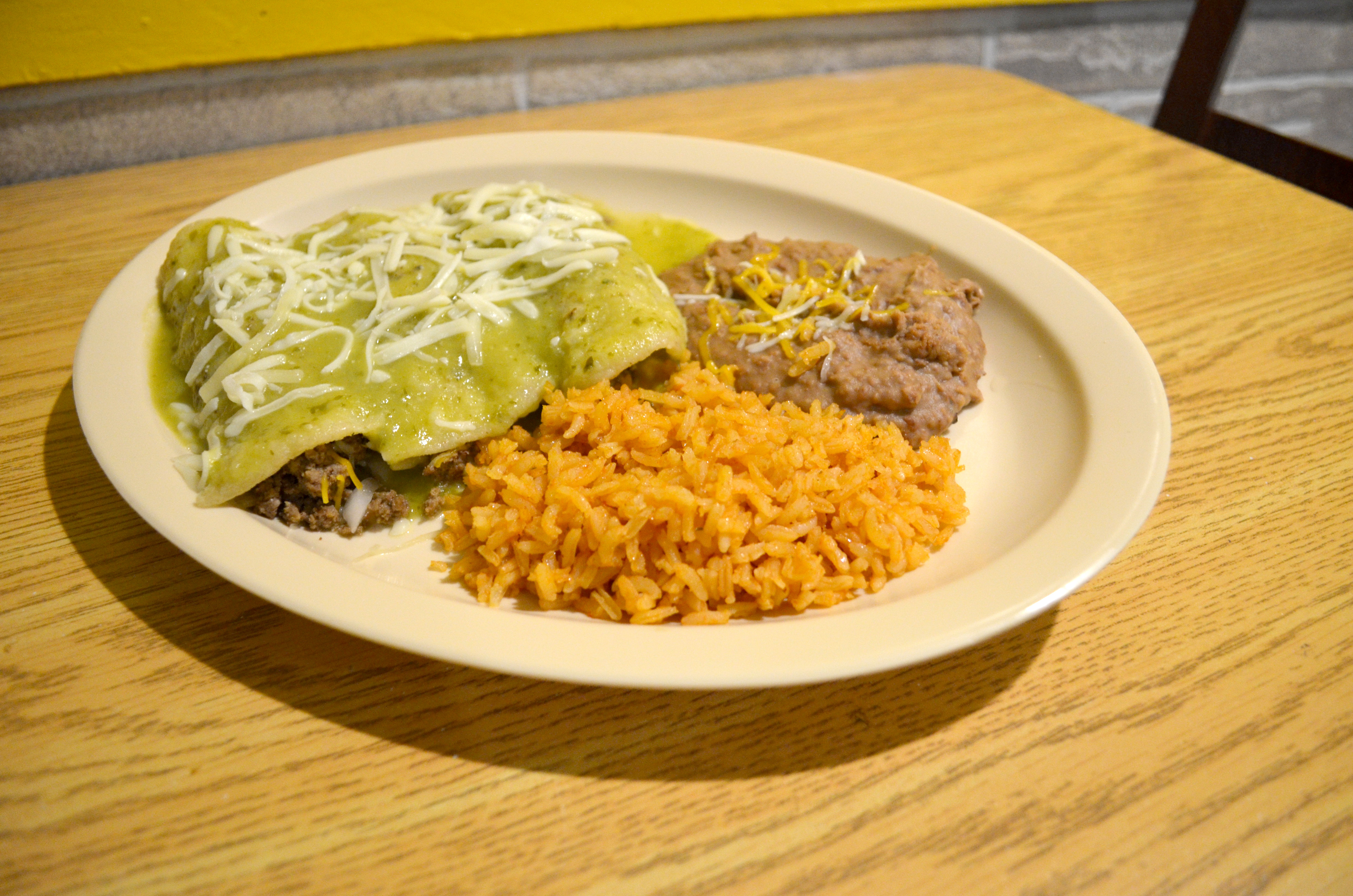 Order #17. Enchiladas Verdes Dinner Plate food online from El Tapatio Restaurant store, Muskegon on bringmethat.com