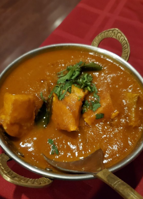 Order Salmon Fish Curry food online from Tandav Indian Cuisine store, Baltimore on bringmethat.com