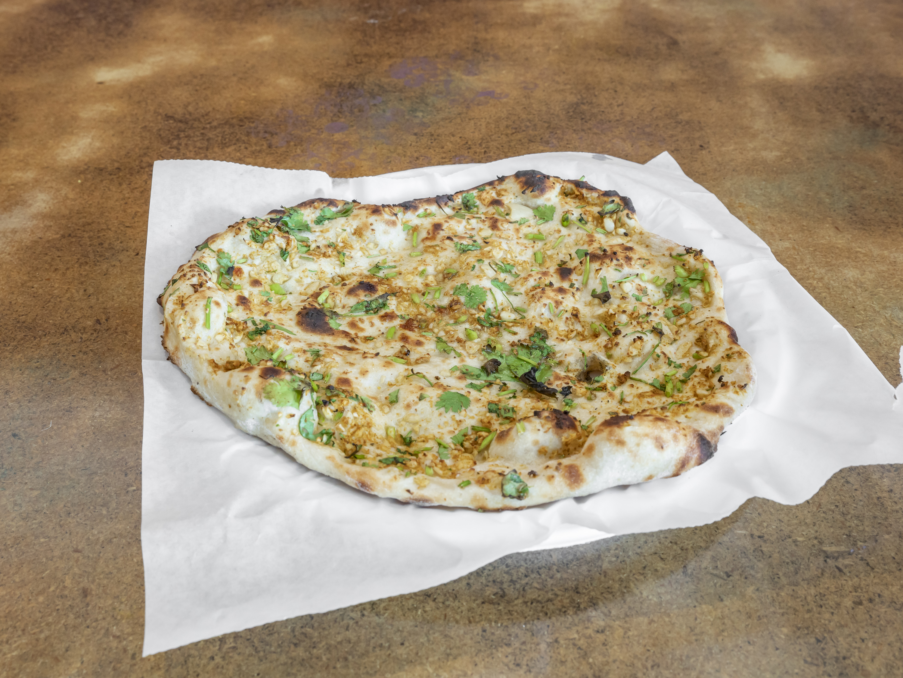 Order Garlic Naan  food online from Little India store, Macon on bringmethat.com